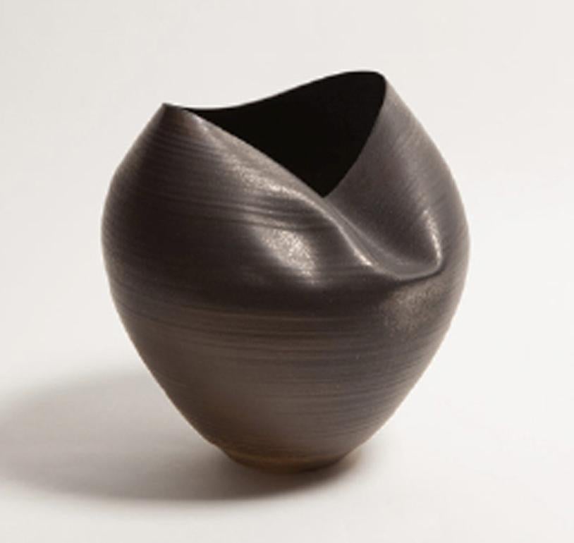 Sumptuous unique ceramic vessels from artist Nicholas Arroyave-Portela.

10 Pieces selected from his portfolio.

- Vessel number 3 - 'Large Black Collapsed Form' - H 35cm x W 30cm x D 30cm
- Vessel number 7 - 'White Irregular Form' - H 32cm x W 30cm