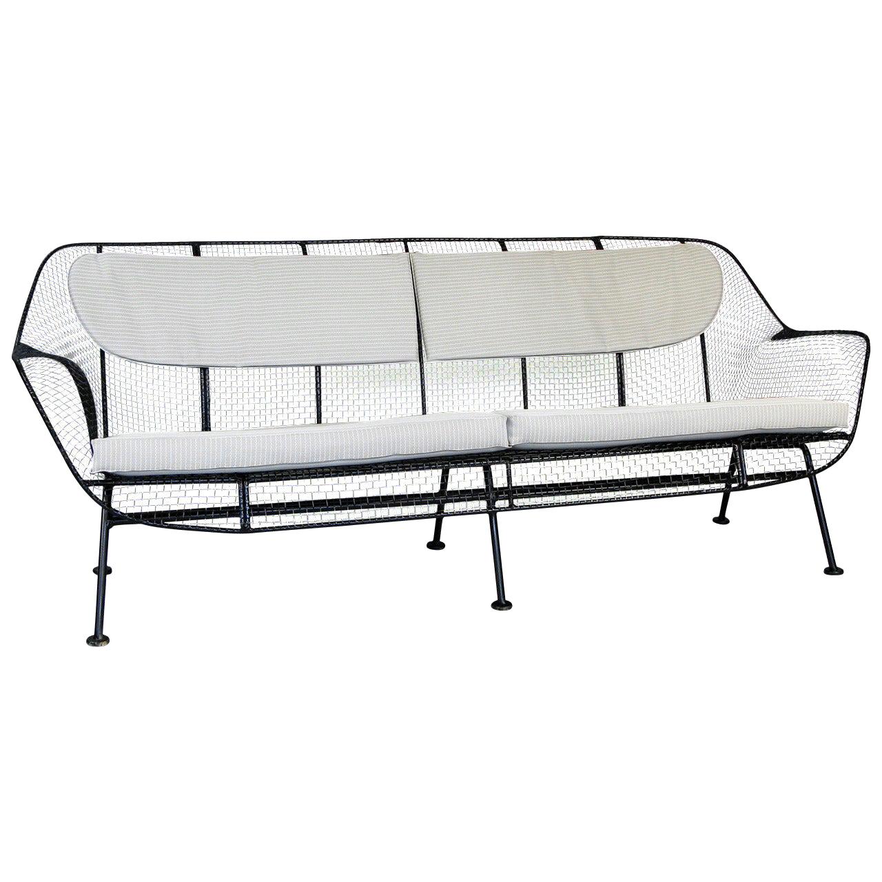 Rare 1950s Sculptura Sofa by Russell Woodard
A rare example of Russell Woodard's iconic sculptura long sofa in wrought iron and woven steel mesh. Beautiful proportions in this wide and deep lounge sofa make this very comfortable and stylish.