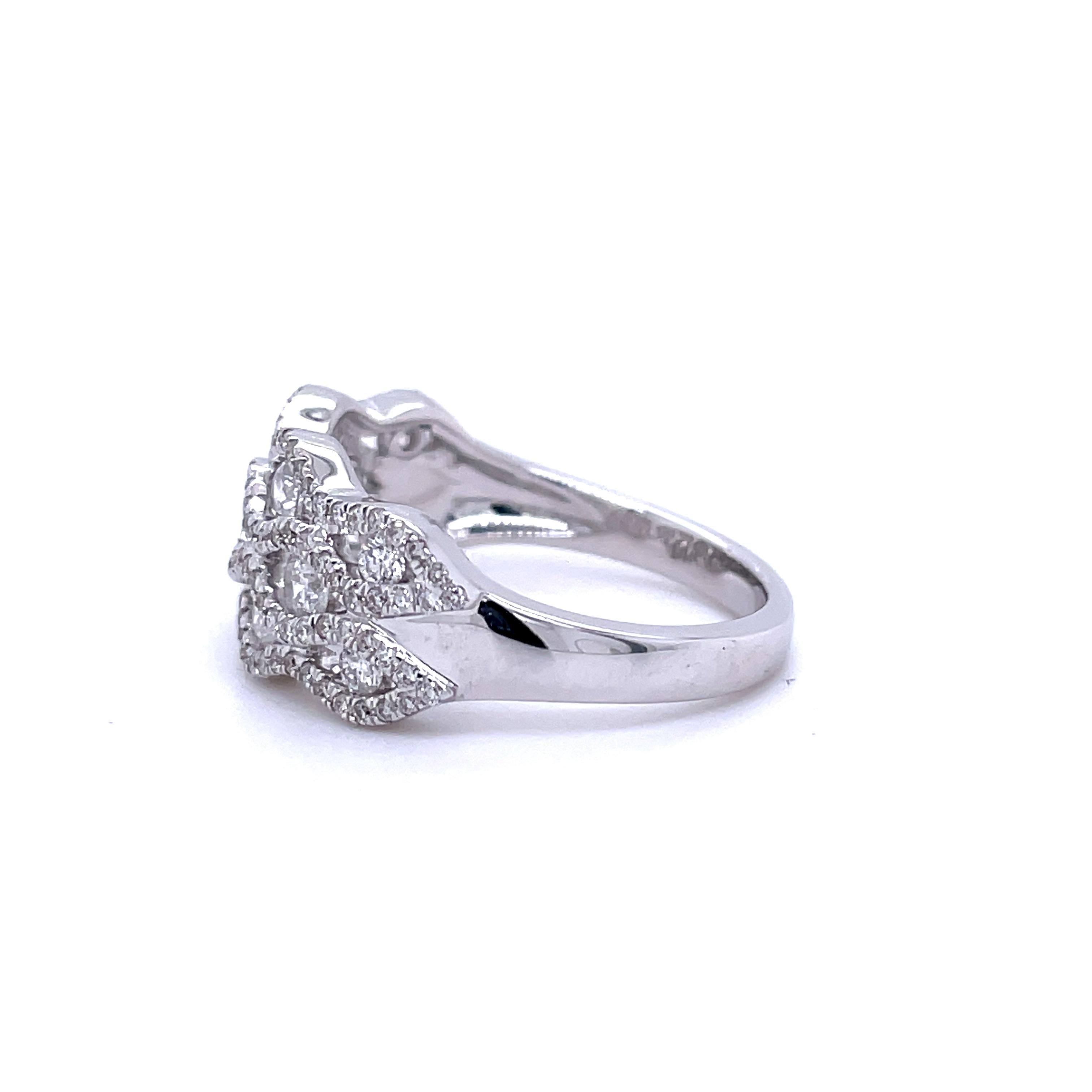 An exquisitely designed cocktail ring crafted in luxurious 14 karat white gold showcasing 129 round brilliant diamonds weighing 1 CTTW (H-I color I1 clarity) This is an amazing eye-catching design that can be worn on any finger for any occasion and