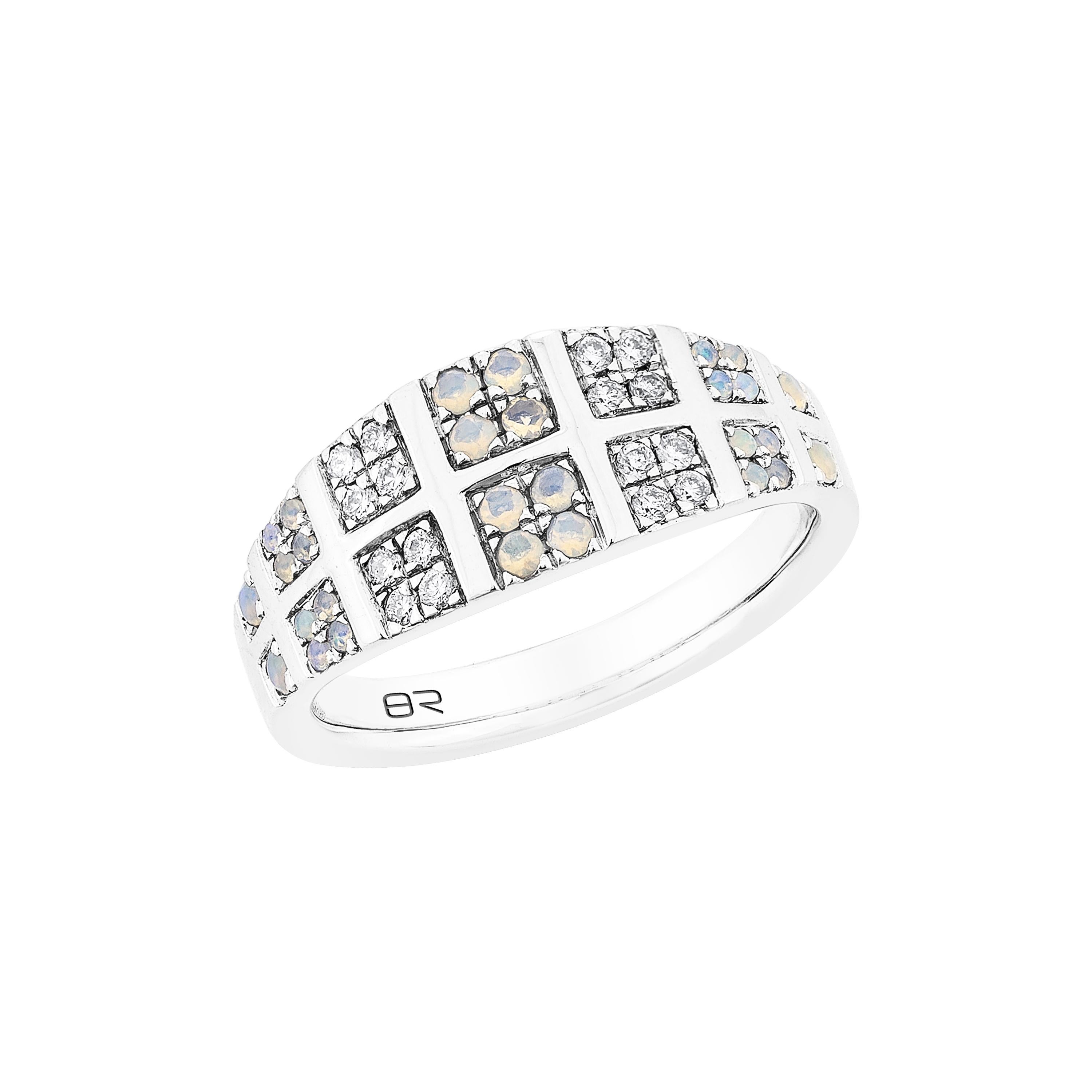 This exquisite Opal Fancy Ring is set in platinum, featuring a captivating opal at its center, surrounded by sparkling diamonds. The vibrant play-of-color in the opal contrasts beautifully with the brilliance of the diamonds, creating a timeless,