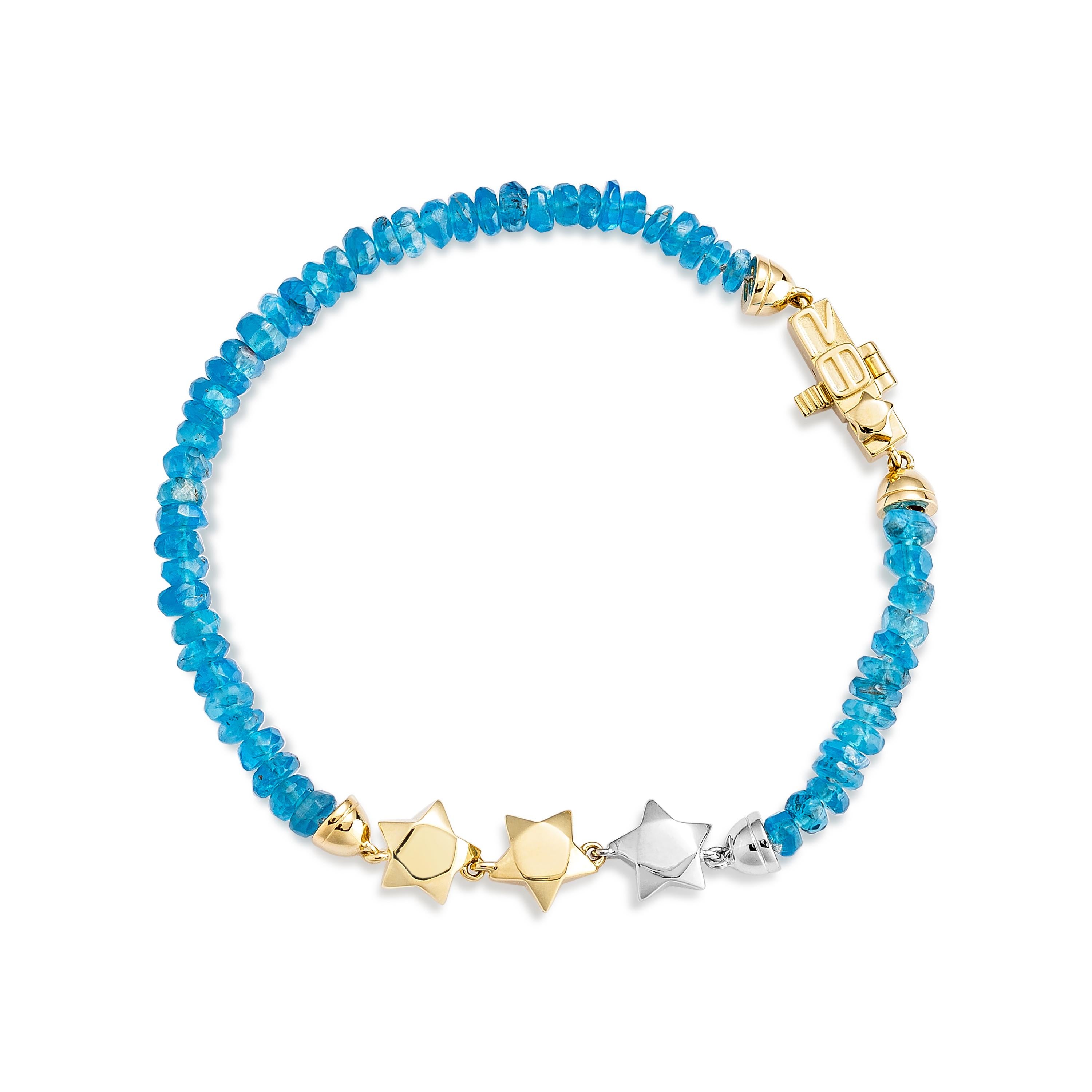 Vibrant et captivant, ce bracelet en apatite néon en or jaune 18 carats présente un ensemble exquis de pierres précieuses bleues vives, exsudant l'élégance et la sophistication moderne. Parfait pour ajouter une touche de couleur audacieuse à