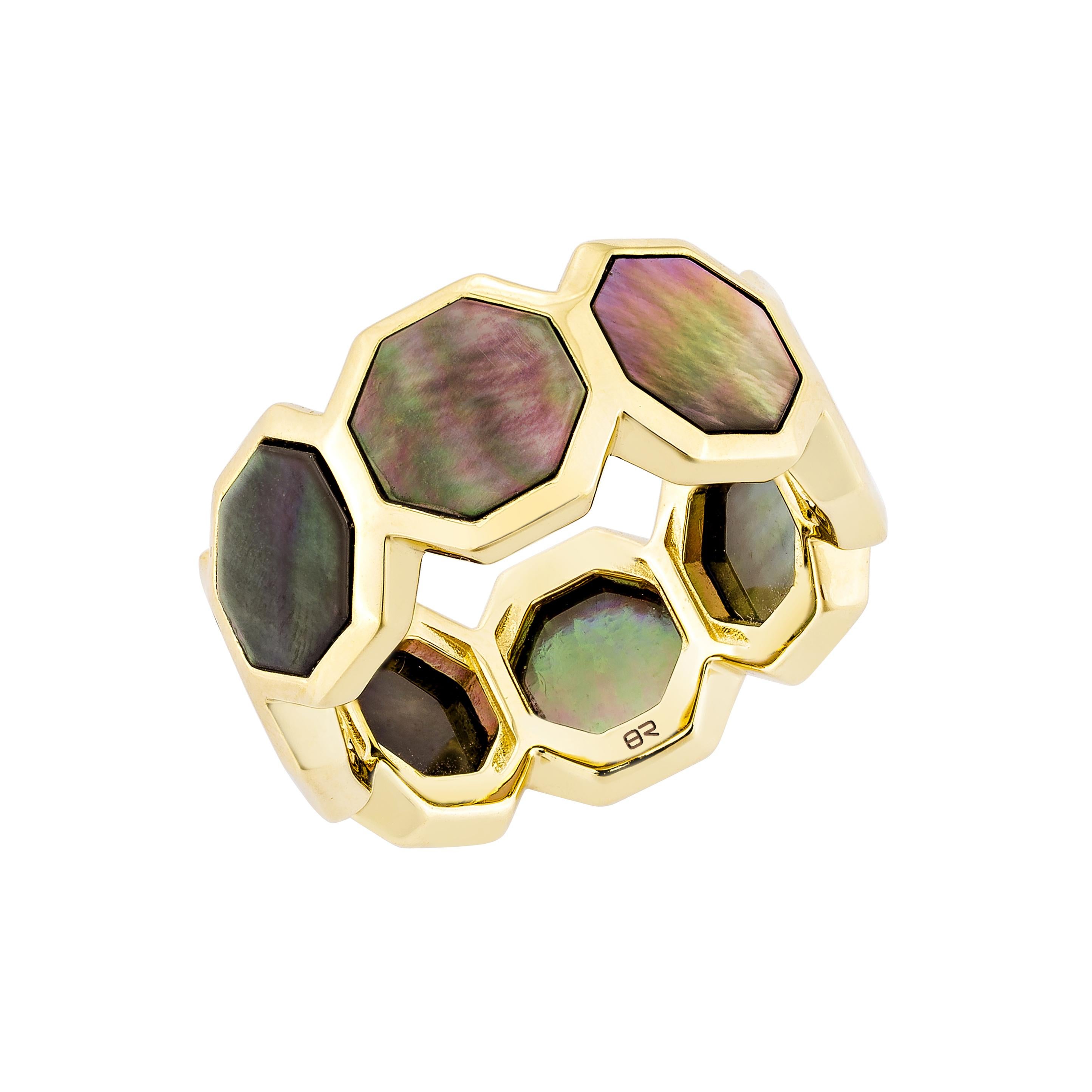 Elegantly crafted in 18K Yellow gold, this fancy ring features a stunning black mother of pearl centerpiece. Its sophisticated design and luminous sheen make it a timeless statement piece for any collection.

black Mother of Pearl Fancy Ring in