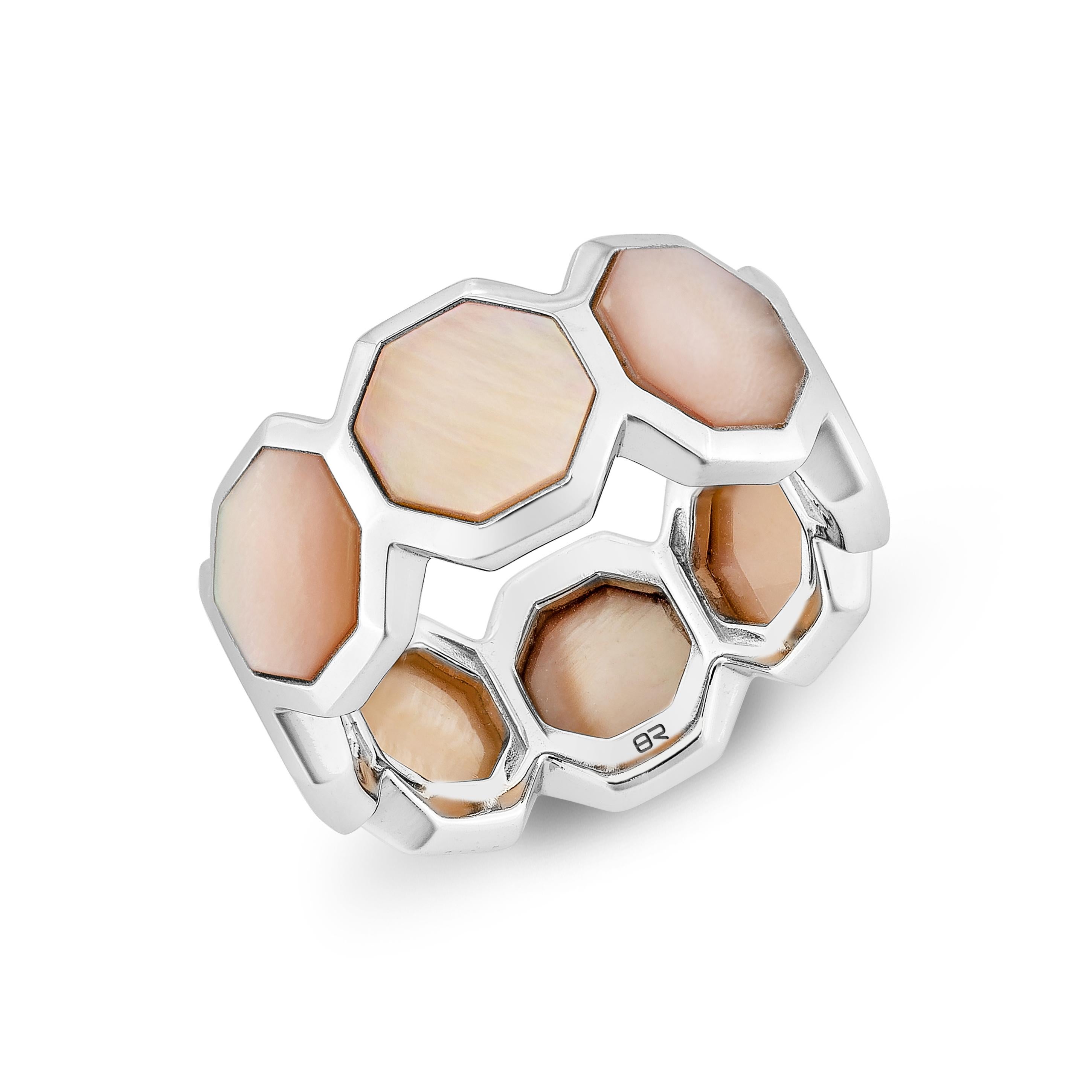 Elegantly crafted in 18K white gold, this fancy ring features a stunning pink mother of pearl centerpiece. Its sophisticated design and luminous sheen make it a timeless statement piece for any collection.

Pink Mother of Pearl Fancy Ring in
