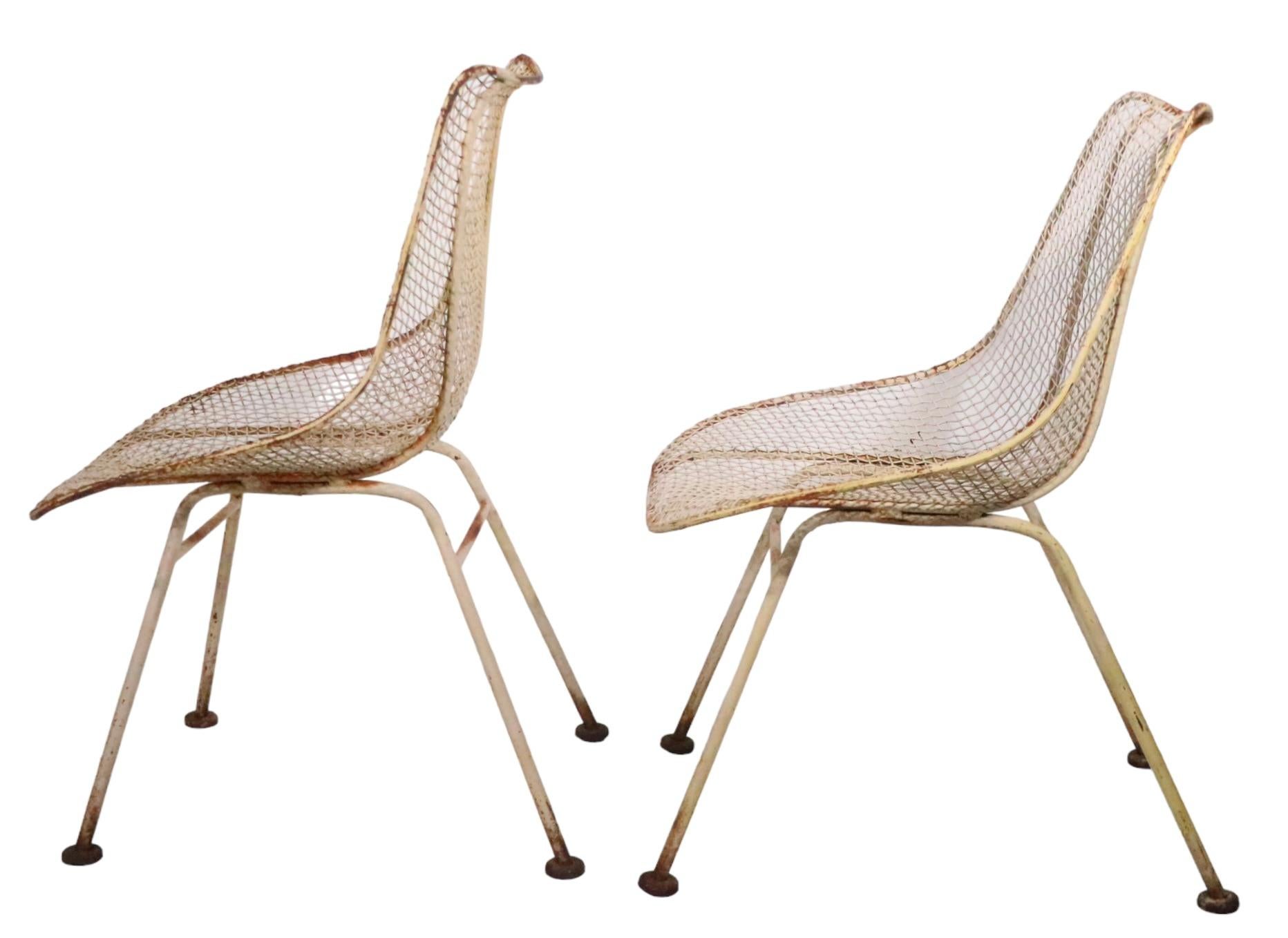 Pr. Mid Century Wrought Iron  Woodard Sculptura Low Side Dining Chairs c 1950's In Fair Condition For Sale In New York, NY