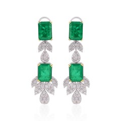 Boucles d
oreilles pendantes en or blanc 18 carats diamants pierres précieuses traitées