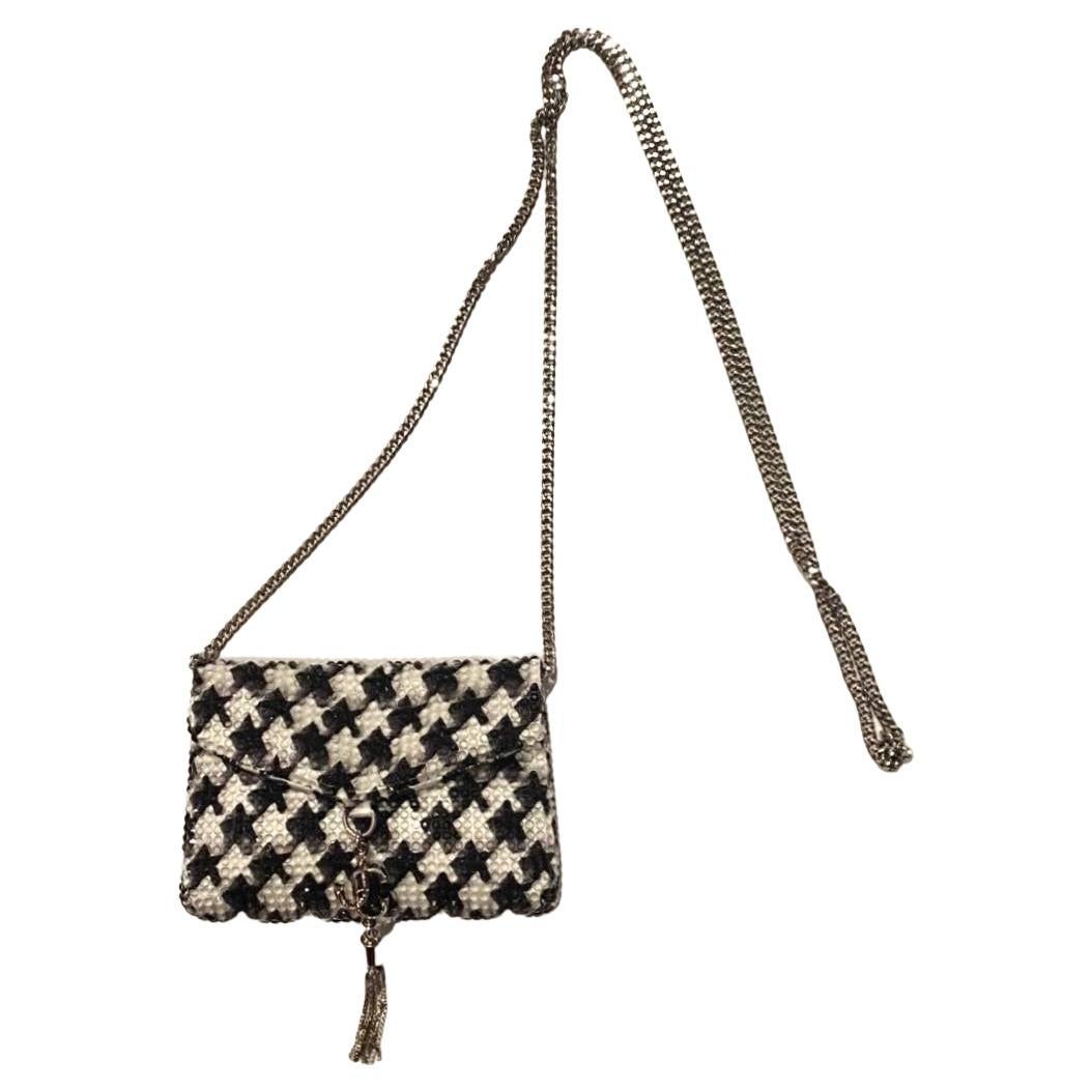 Jimmy Choo card holder in a soft black and white hounds tooth print satin with crystal embellishment, detachable fine chain link silver colour metal strap allows the card holder to be worn on the shoulder or across the body like a micro clutch bag.