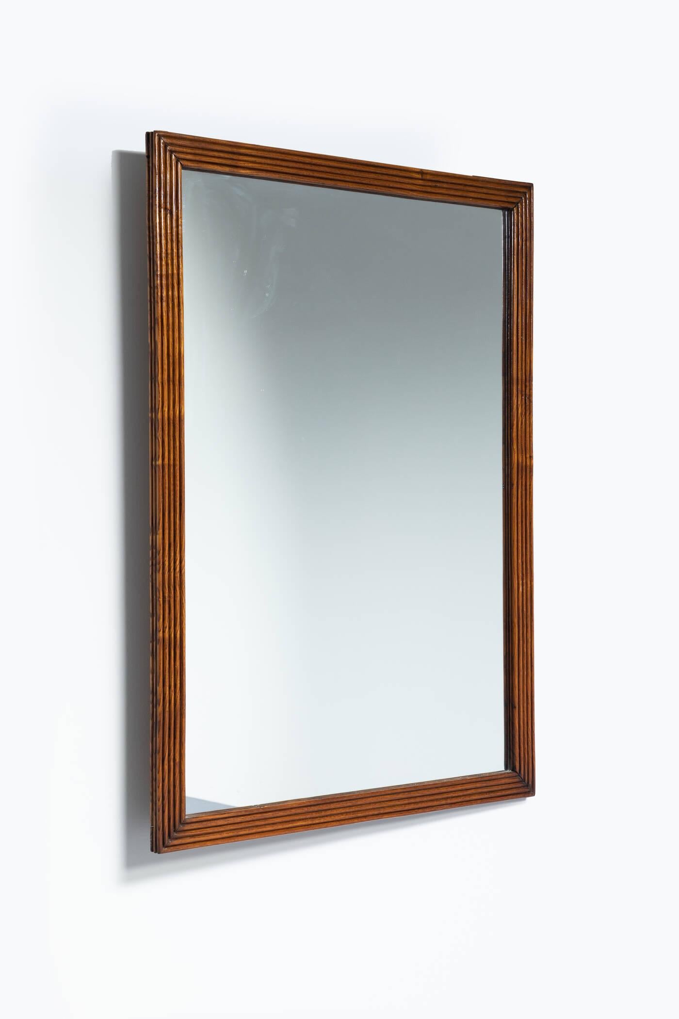 Specchio con cornice a listelli in legno.
Produzione Italiana, Anni '60
