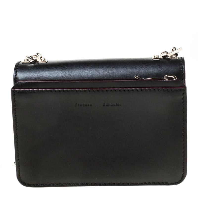 This PS1 bag by Proenza Schouler has a sophisticated look. Crafted from leather, it is held by a chain strap. The flap has a flip lock which opens to a spacious interior. Team this fabulous creation with your everyday outfits.

Includes: Original