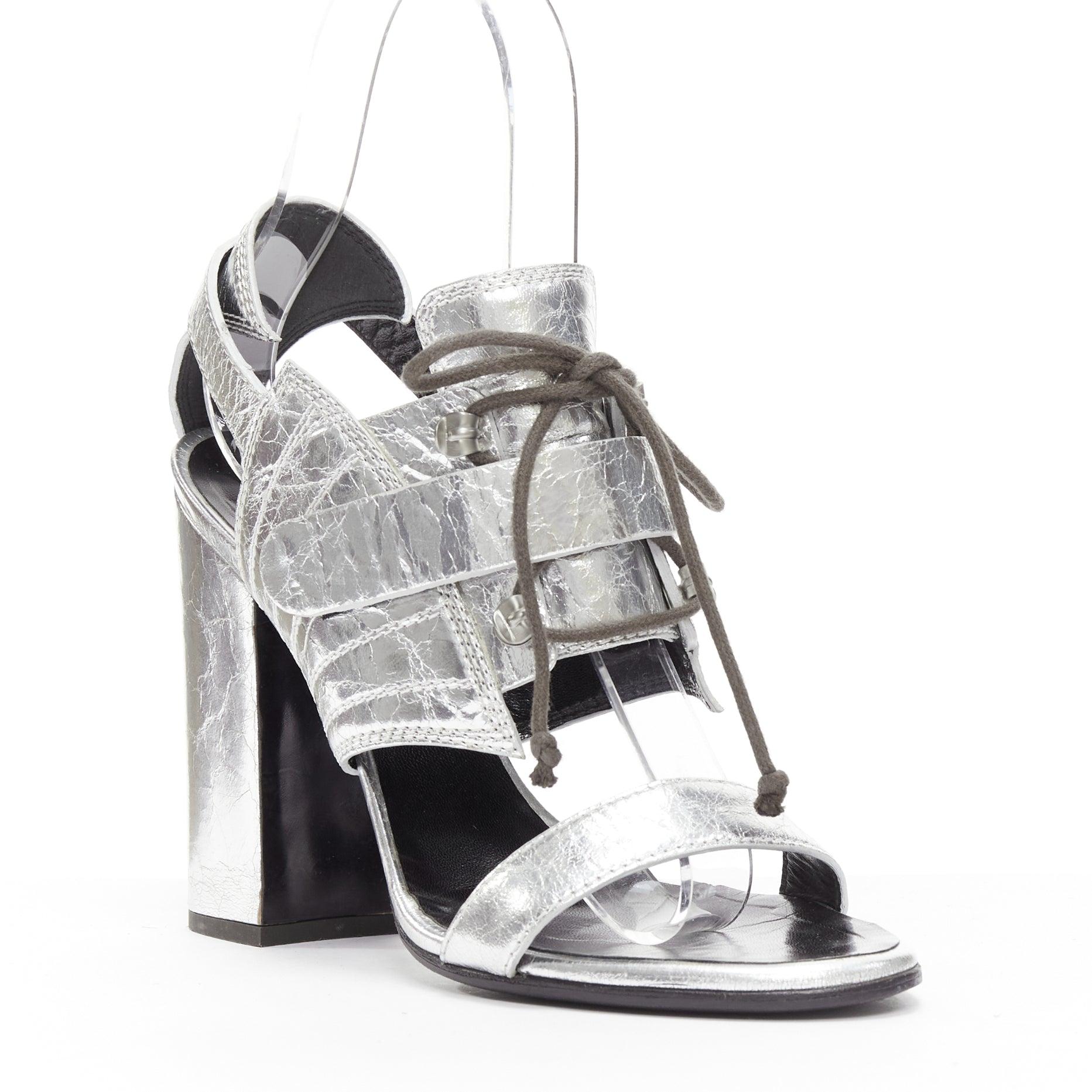 PROENZA SCHOULDER crinkled metallic silver leather laced block heel sandal EU37
Reference: NKLL/A00132
Brand: Proenza Schouler
Material: Leather
Color: Silver
Pattern: Solid
Closure: Lace Up
Lining: Black Leather
Extra Details: Laced and magic tape