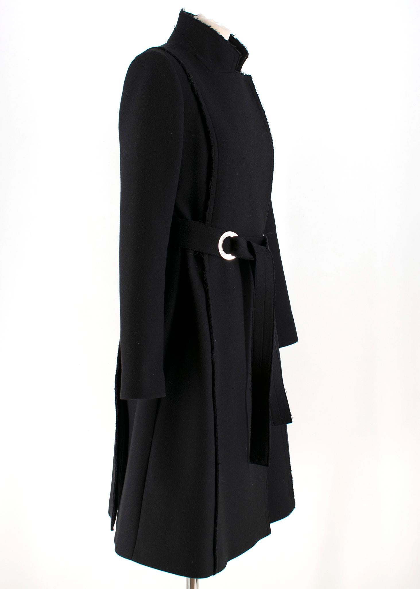 Proenza Schouler Belted Wool Blend Coat

- Black Long Sleeve Wool Coat 
- Swing style coat with vertical panels 
- stand or lapel collar 
- Sewn-in belt with silver tones circle detail 
- Discreet snap fastenings 
- Exposed raw seams

Please note,