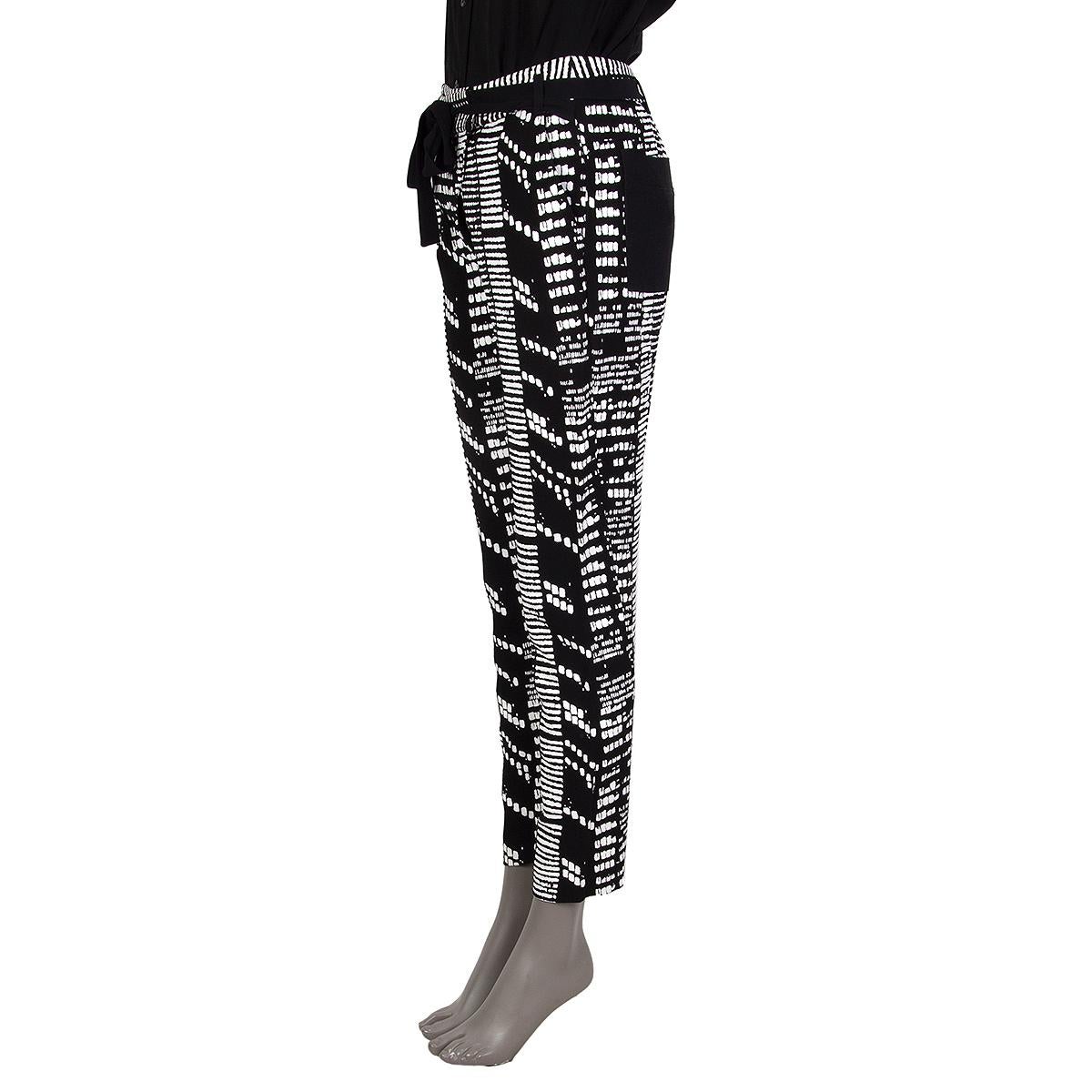 100% authentic Proenza Schouler color cast pants in black viscose (100%) with pockets. White combo is acetate (74%) and viscose (26%). Close on the front with a zipper and attached wrap around belt. Unlined. Have been worn and are in excellent