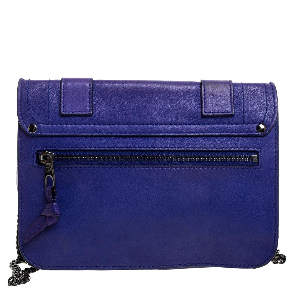 This wallet from Proenza Schouler will do justice to both style and comfort. Compliment your attire by adorning this classic PS1 wallet in a striking blue hue. It has been crafted meticulously from quality leather. It is styled with a front flap,