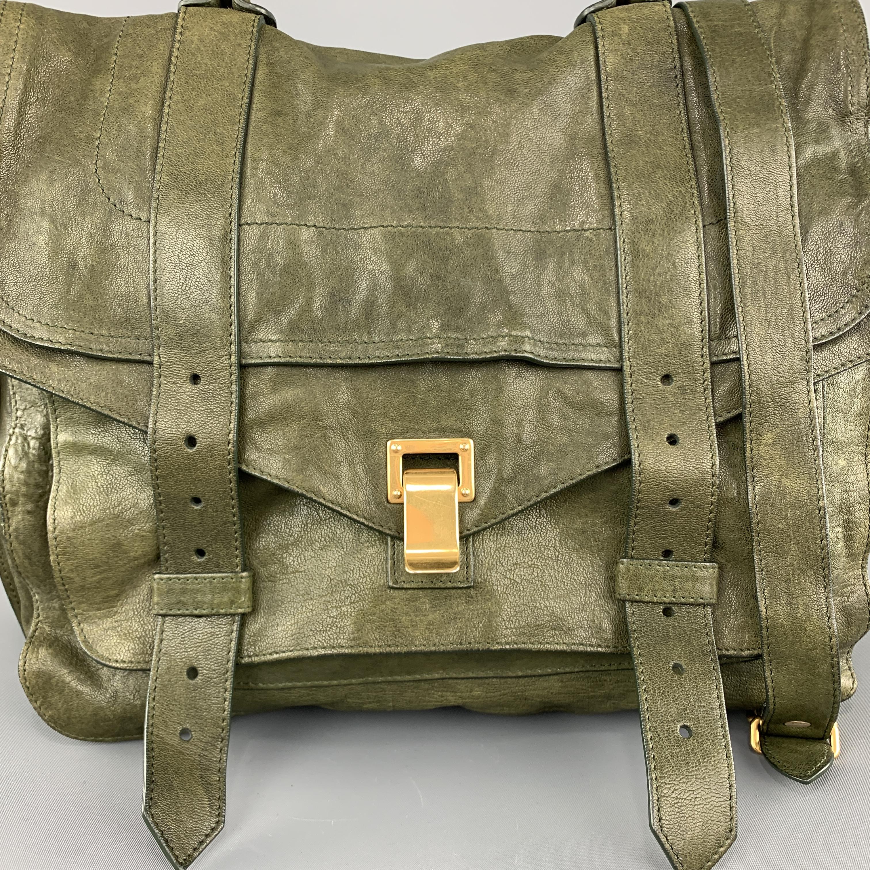 PROENZA SCHOULER PS1 satchel bag comes in olive green textured leather with a flap front, gold tone clasp closure, top handle, back zip pocket, and detachable crossbody strap. Made in Italy.

Good Pre-Owned Condition.

Measurements:

Length: 13