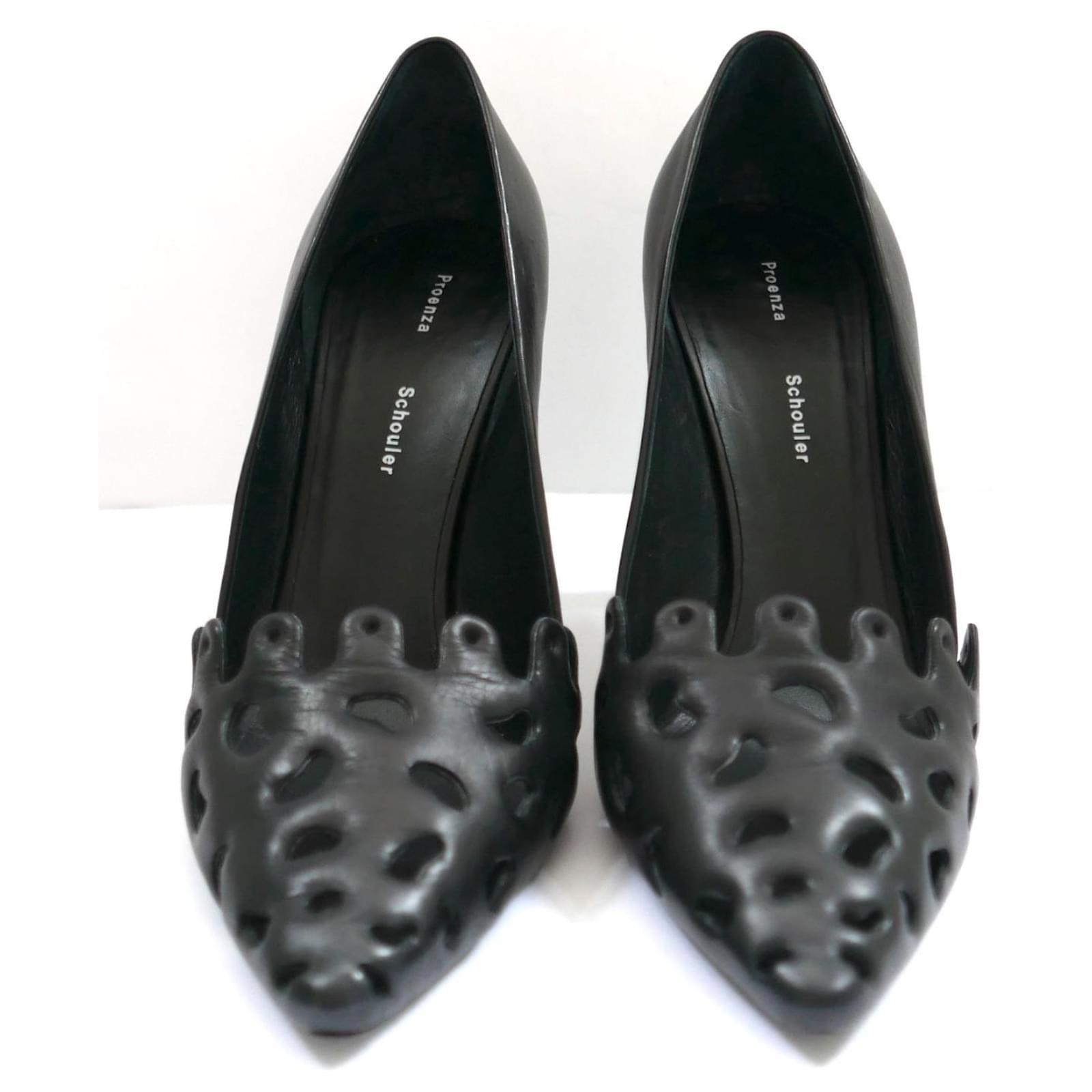 Darkly chic Proezna Schouler pumps - bought for £595 and worn once. Made from smooth black leather, they have arty Gaudi inspired cut-out fronts and sturdy stiletto heels. Size 38.5. Measure approx - 10” heel to toe inside and heel is 4”.

