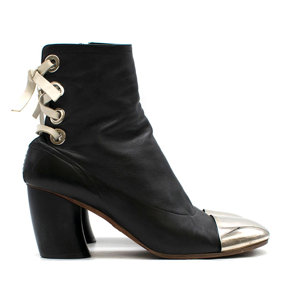 Proenza Schouler metal-cap lace-back leather ankle boots

- Black, soft-touch leather 
- Round toe, mid-high black curved cone heel 
- Silver-tone metal toe caps
- White lace-up leather back feature
- Inner side-zip fastening 
- Red leather insole,