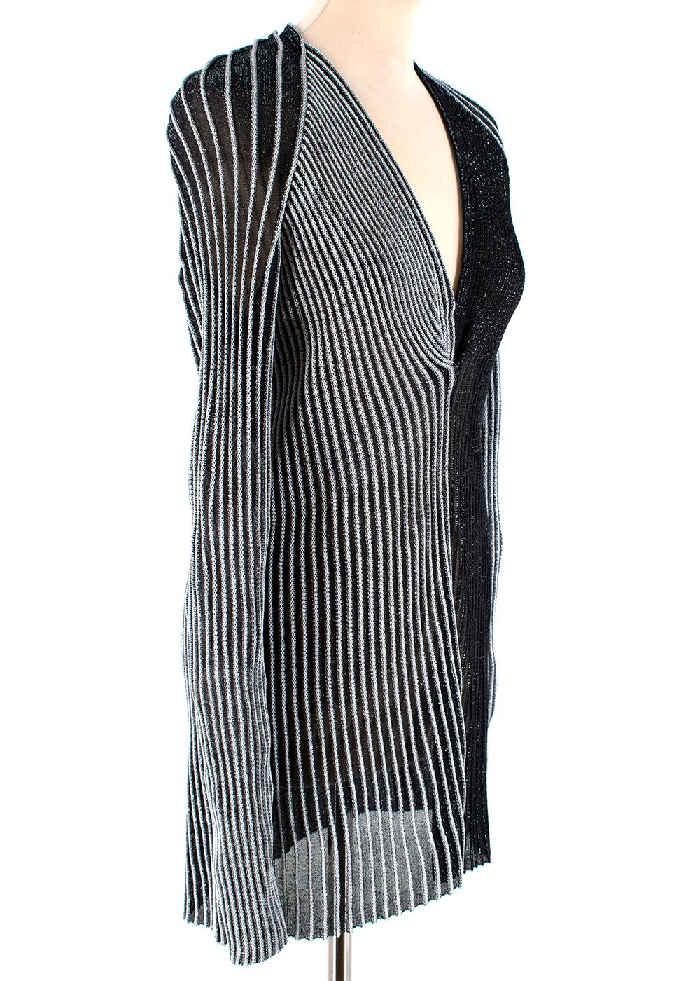 Proenza Schouler Metallic Striped Contrast Ribbed-Knit Top

- Silver/Black metallic ribbed knitted top 
- Contrast stripe design 
- Fine knit 
- Plunge neckline 
- Pull on style 

Materials: 
76% Viscose, 24% Polyester 

Dry Clean Only 

Made in