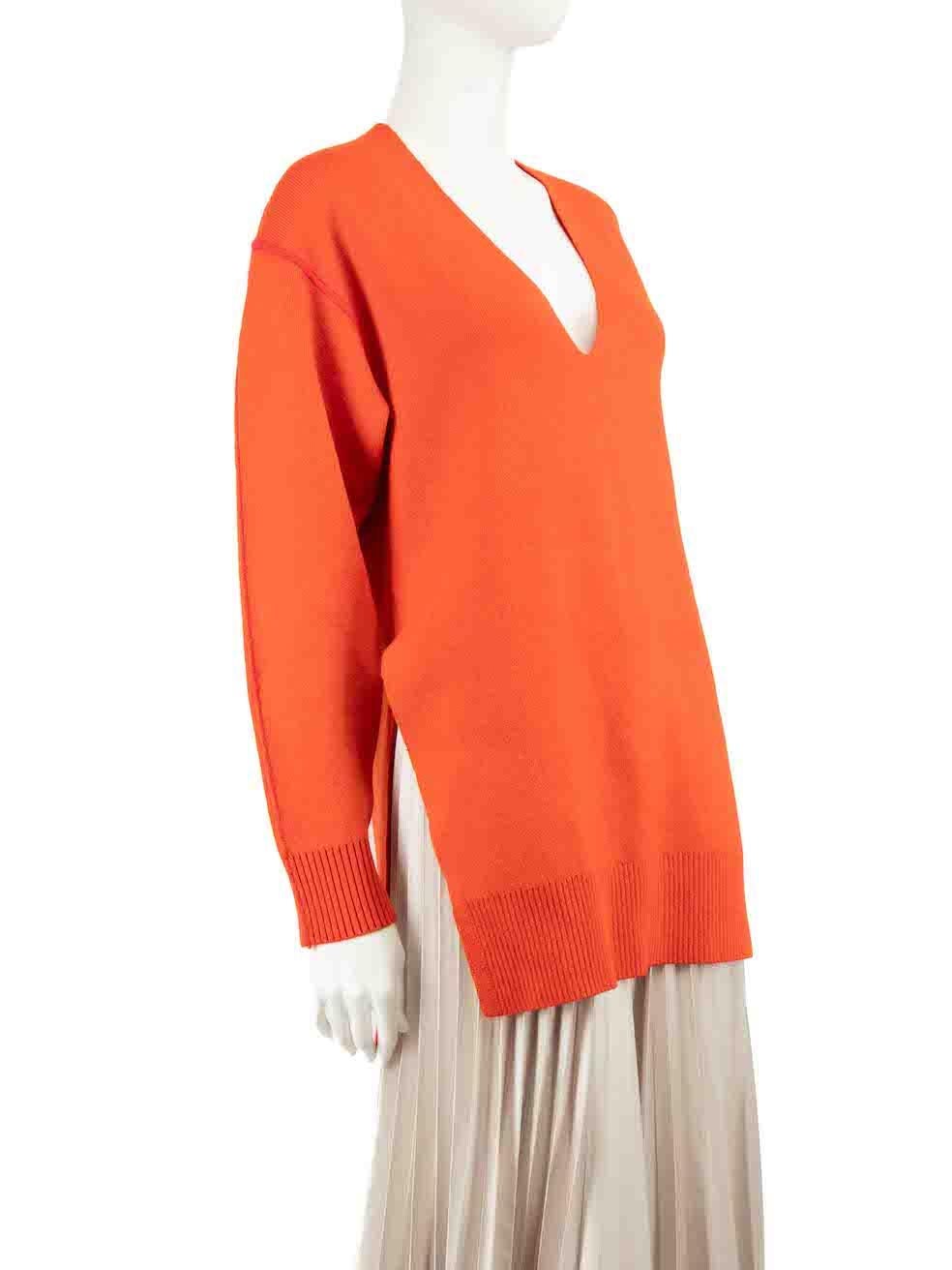 CONDITION is Very good. Minimal wear to jumper is evident. Small marks to the cuff edges, front hem and right side sleeve on this used Proenza Schouler designer resale item.
 
 Details
 Orange
 Wool
 Knit sweater
 Long sleeves
 V-neck
 Slit side