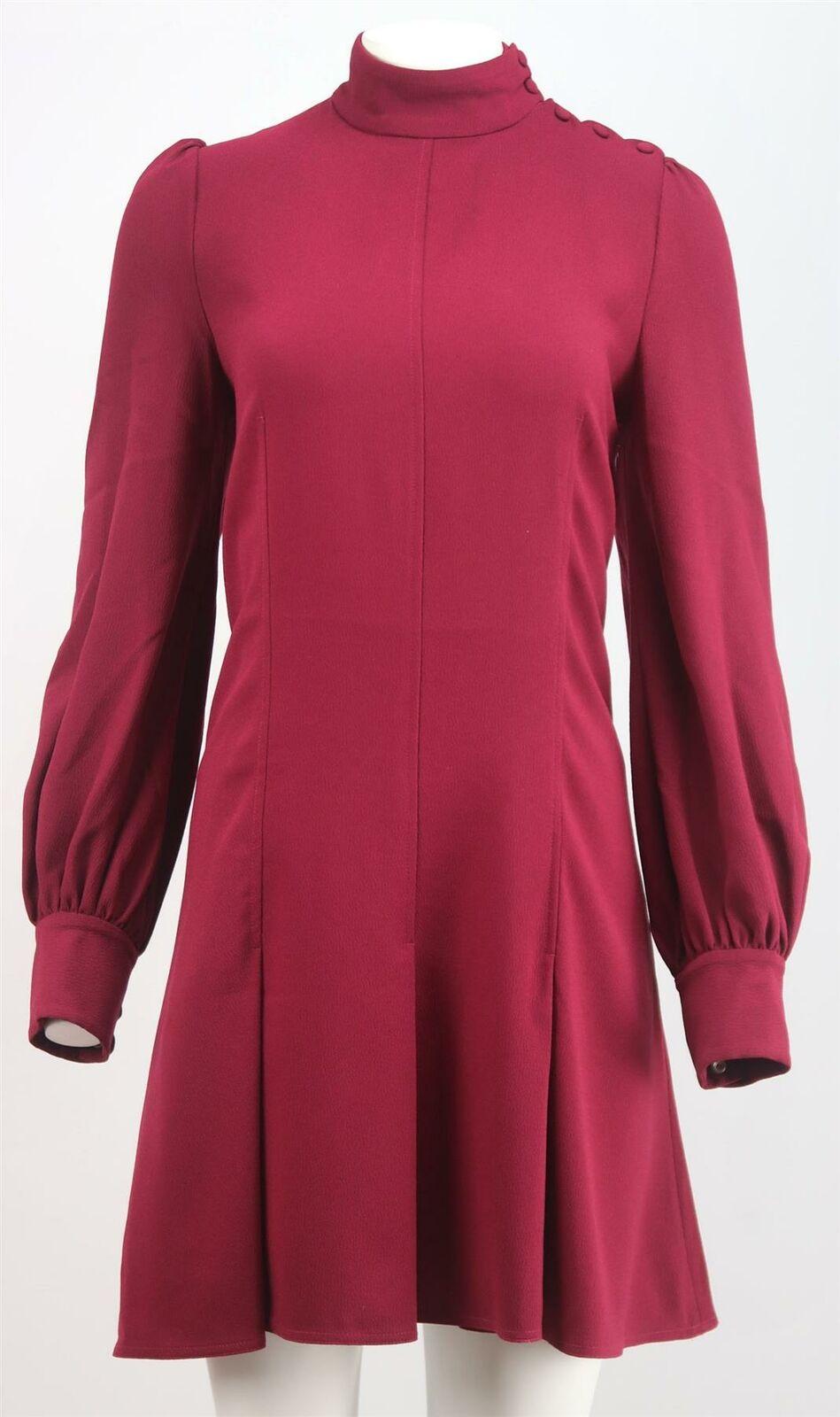 Proenza Schouler's dress is sophisticated, timeless and never goes out of style, cut from textured crepe, this mini version has a high neck, puff sleeves and a wispy skirt and is accentuated by soft pleats.
Burgundy crepe.
Button fastening at