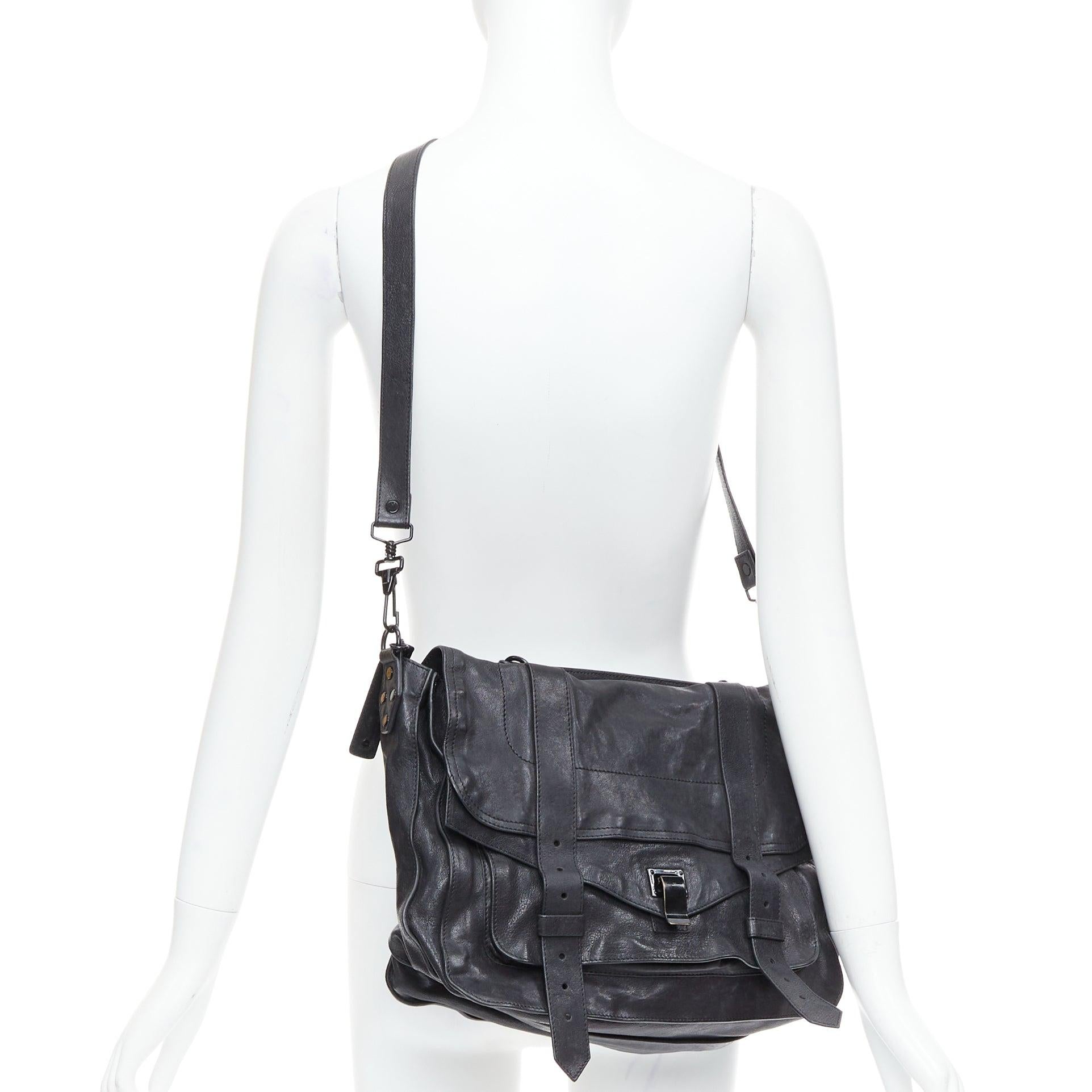 PROENZA SCHOULER PS1 black leather satchel bag Mary-kate Olsen
Reference: ECLO/A00062
Brand: Proenza Schouler
Model: PS1
As seen on: Mary-kate Olsen
Material: Leather
Color: Black, Silver
Pattern: Solid
Closure: Loop Through
Lining: Grey