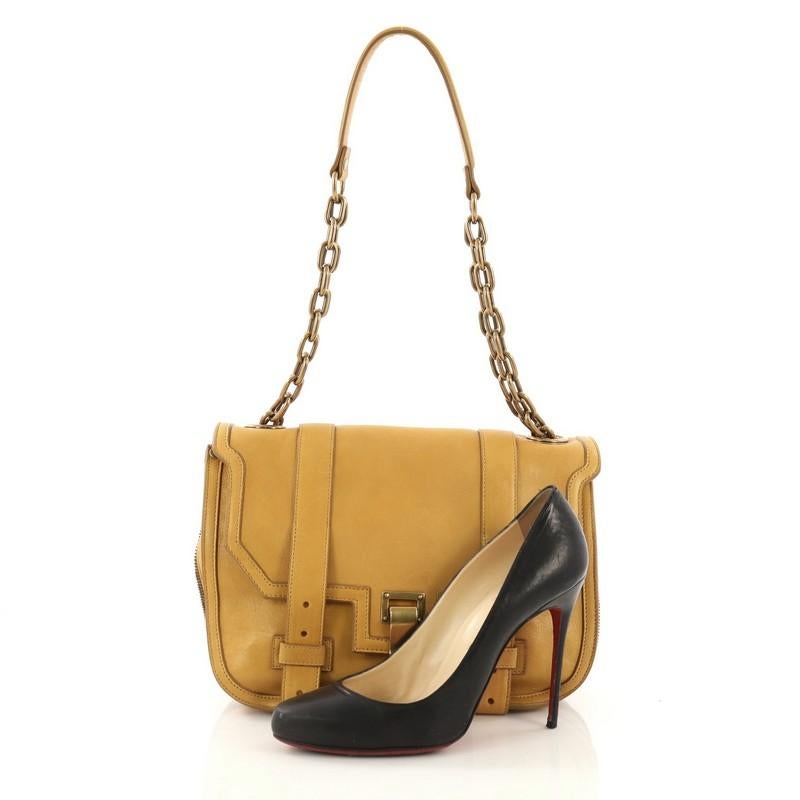This Proenza Schouler PS1 Chain Messenger Bag Leather Mini, crafted from mustard yellow leather, features chain link strap with leather shoulder pad, zip-around detailing that expands the bag, exterior back zip back pocket, and aged gold-tone