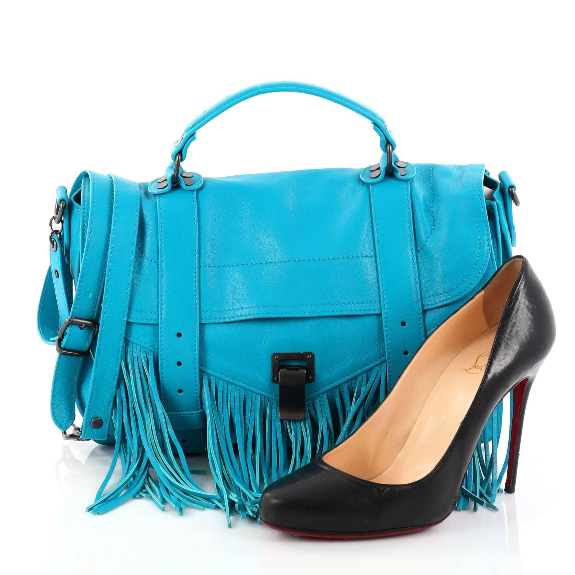 This authentic Proenza Schouler PS1 Fringe Handbag Leather Medium mixes the brand's iconic It bag with vintage-inspired styling made for modern fashionistas. Constructed in blue leather, this stylish satchel features flat top handle, cascading