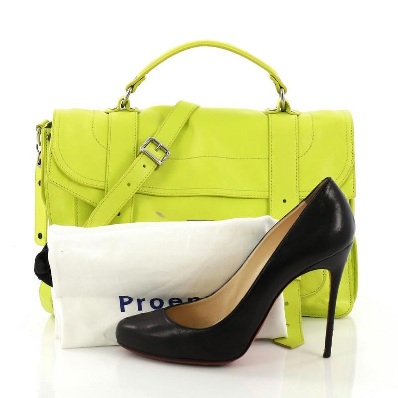 This Proenza Schouler PS1 Satchel Leather Medium, crafted in neon yellow leather, features a leather top handle, exterior back zip pocket, and silver-tone hardware. Its flip-clasp closure opens to a brown fabric interior with a zip pocket. **Note: