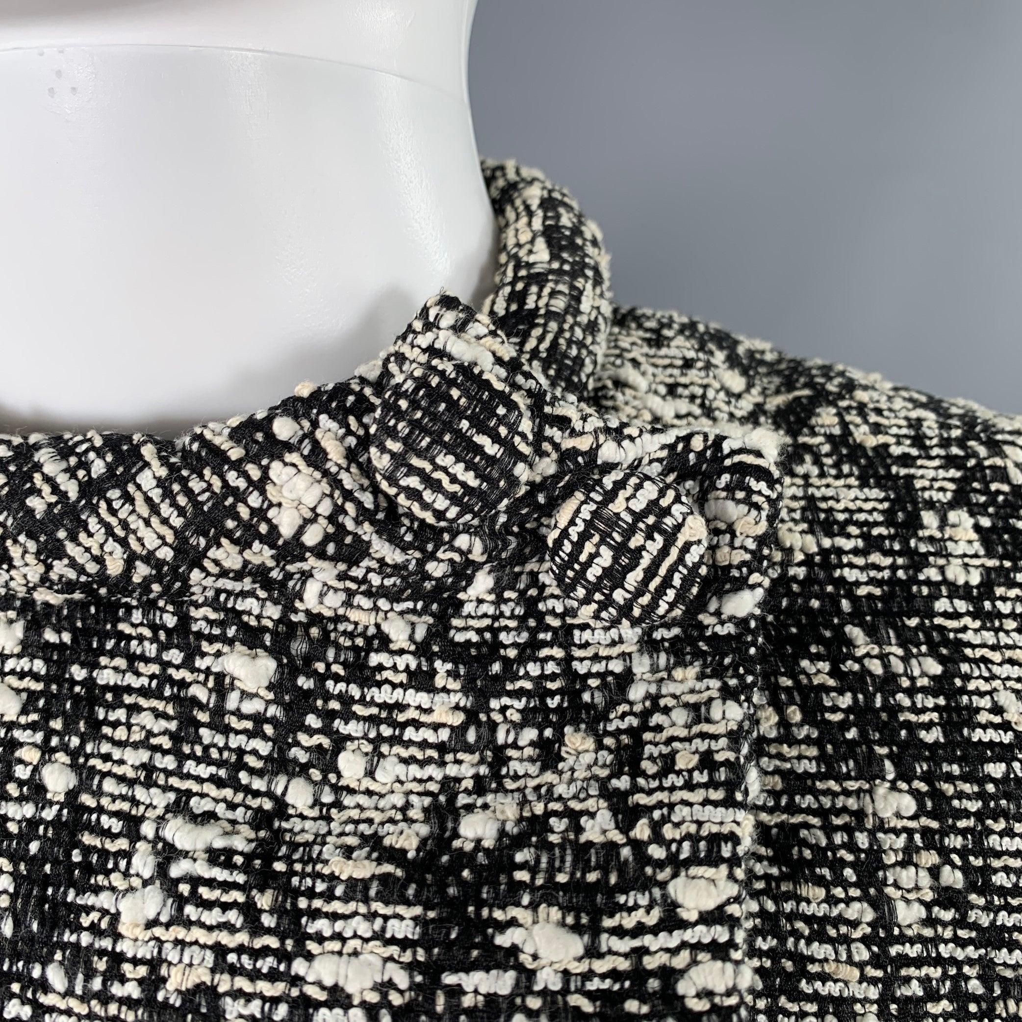 PROENZA SCHOULER jacket
in a black and white cotton blend boucle featuring a collarless style, long sleeves, and asymmetrical snap closure.Excellent Pre-Owned Condition. 

Marked:   2 

Measurements: 
 
Shoulder: 13.5 inches Bust: 36 inches Sleeve: