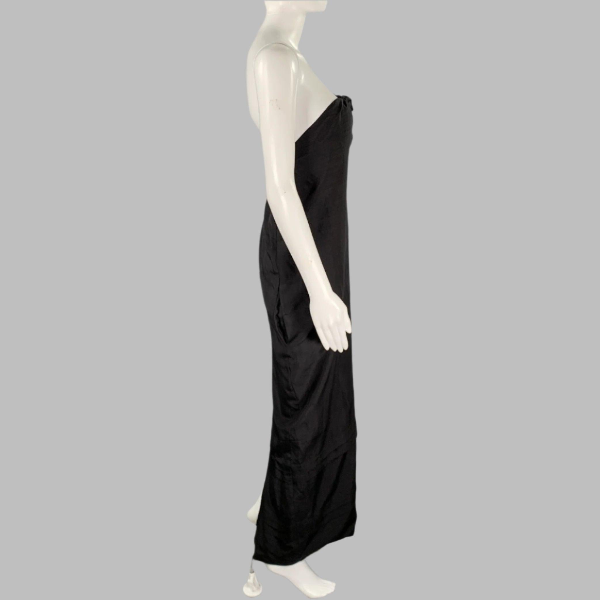 PROENZA SCHOULER dress
in a black silk featuring a strapless style, knot with keyhole, and layered skirt details. Excellent Pre-Owned Condition. 

Marked:   6 

Measurements: 
  Bust: 36 inches Waist: 35 inches Hip: 38 inches Length: 45 inches 
  
 