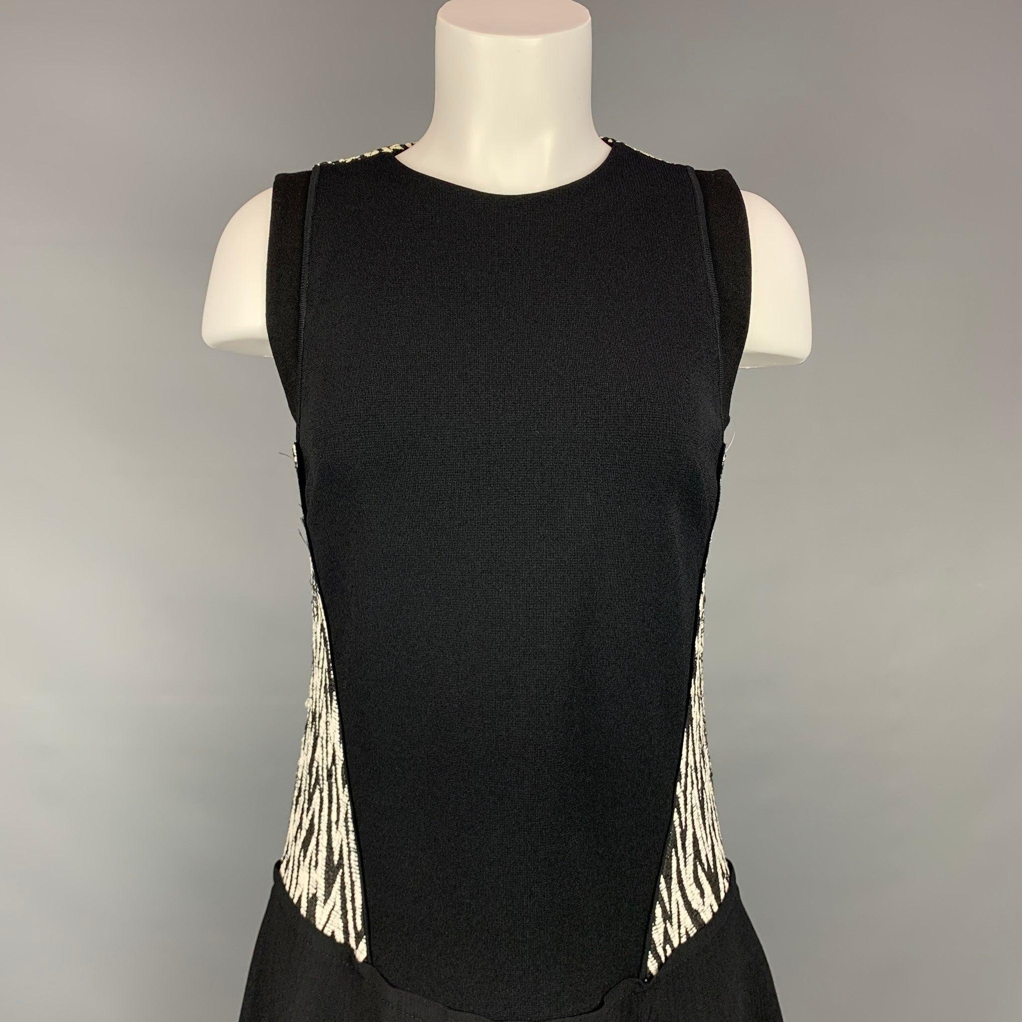 PROENZA SCHOULER dress comes in a black & white acrylic blend featuring a sleeveless style, a-line, and a a back zip up closure. Made in Italy.Very Good
Pre-Owned Condition. 

Marked:   6 

Measurements: 
  Bust: 32 inches  Waist: 30 inches  Hip: 36