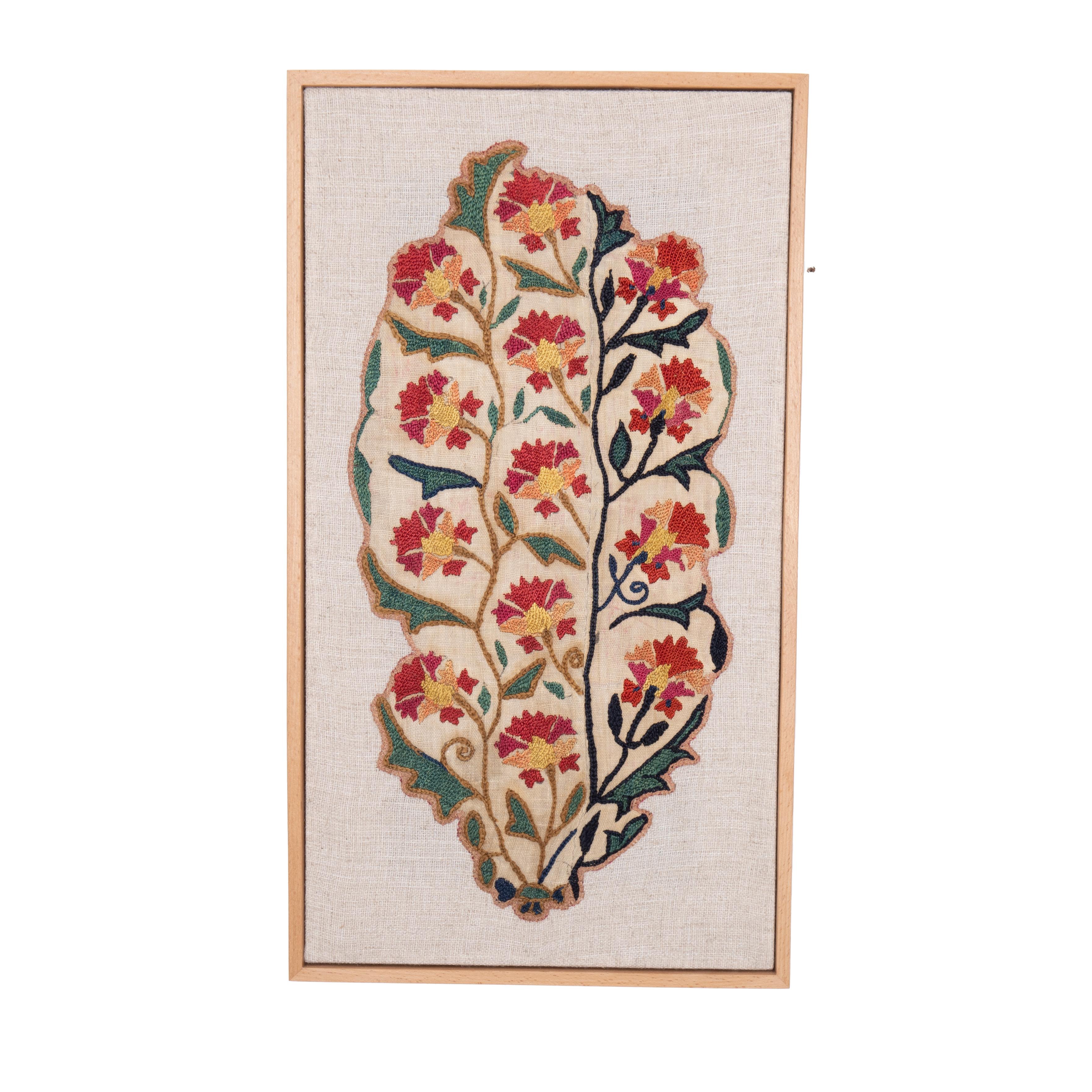 First the fragment has been hand backed on a linen fabric, then stretched over a wooden stretcher and finished with a wooden frame.
Late 19th C. Uzbekistan
Ready to go on any wall.

Framed Item above is made from a used and antique embroidery