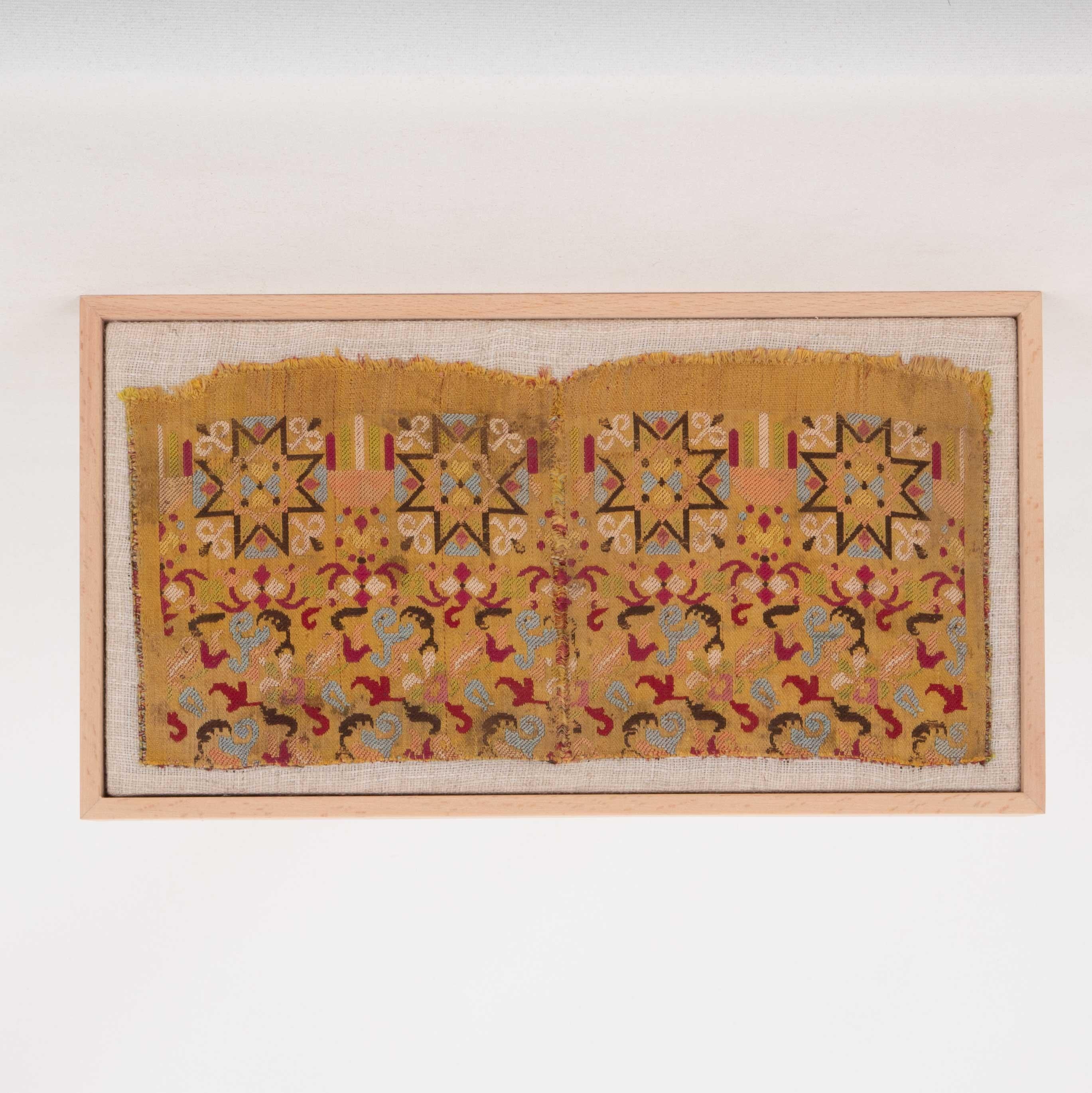 First the fragment has been hand backed on a linen fabric, then stretched over a wooden stretcher and finished with a wooden frame.
Early 20th C.. Morocco
Ready to go on a wall.
