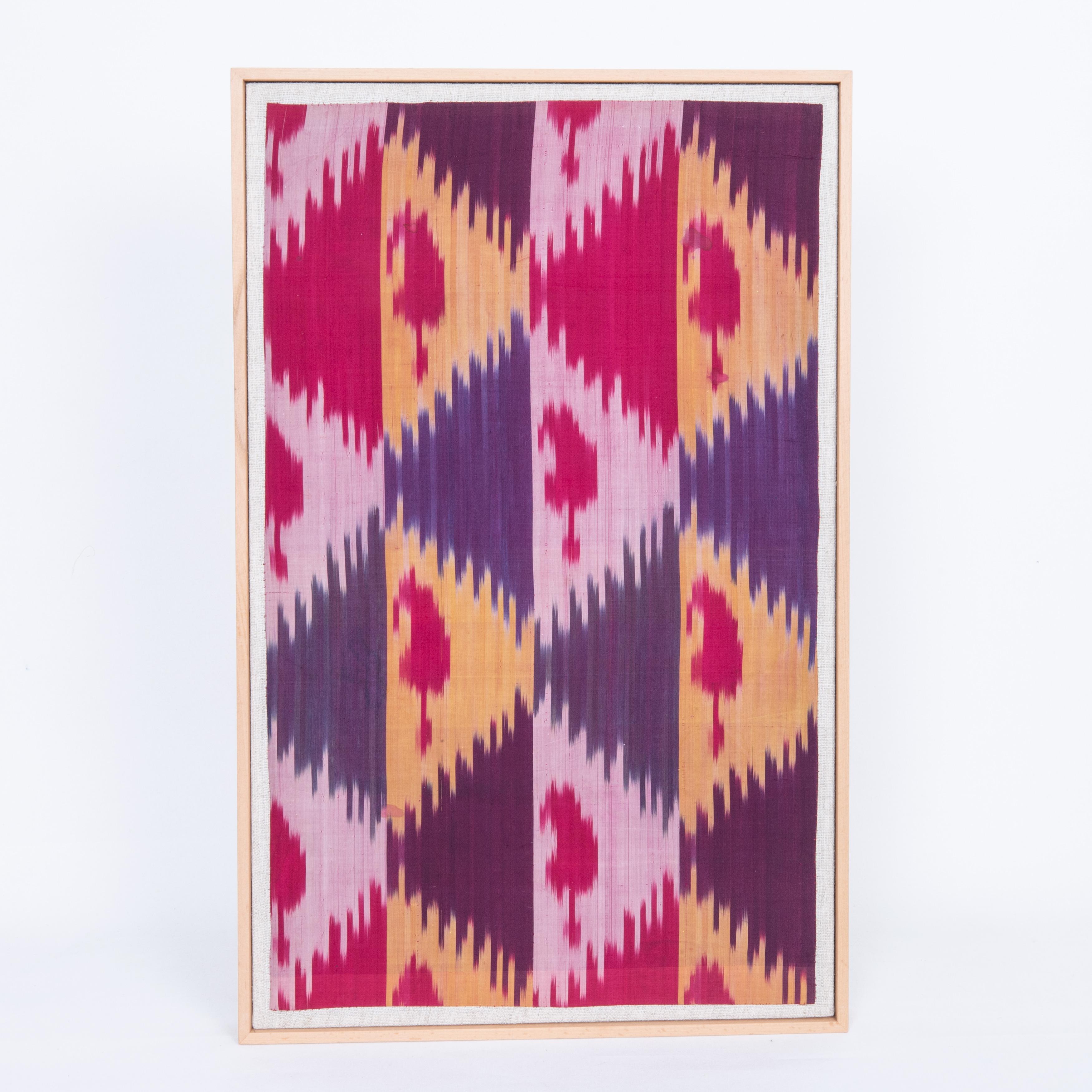 First the fragment has been hand backed on a linen fabric, then stretched over a wooden stretcher and finished with a wooden frame.
Early 20th C. Uzbekistan.
Ready to go on a wall.

Framed Item above is made from a used and antique embroidery
