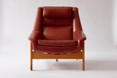 Mid-century Modern, Swedish Ottoman Leather and Oak Chair by Folke Ohlsson, Red