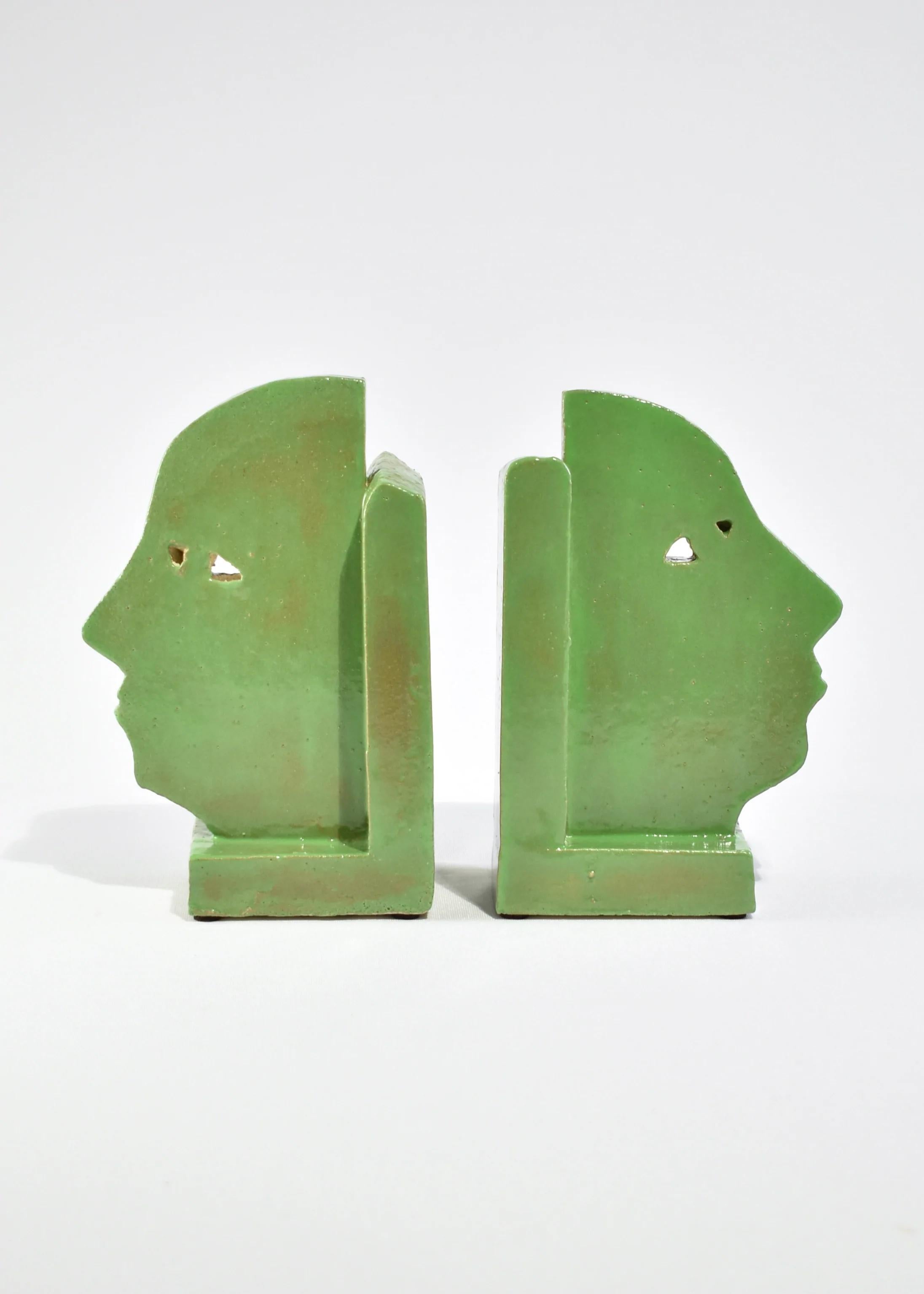 Handmade slab-built bookends with a face profile design in green, set of two. By Shane Gabier, made in NYC.

Please note that this item is handmade and therefore unique; slight variations in color and shape are to be expected.