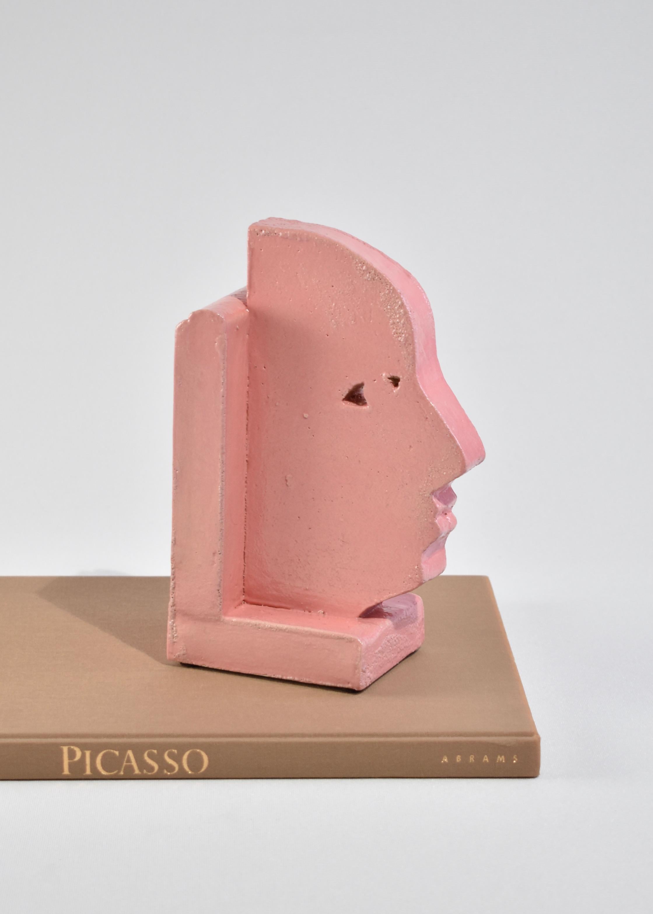 Handmade slab-built bookends with a face profile design in pink, set of two. By Shane Gabier, made in NYC.

Please note that this item is handmade and therefore unique; slight variations in color and shape are to be expected.