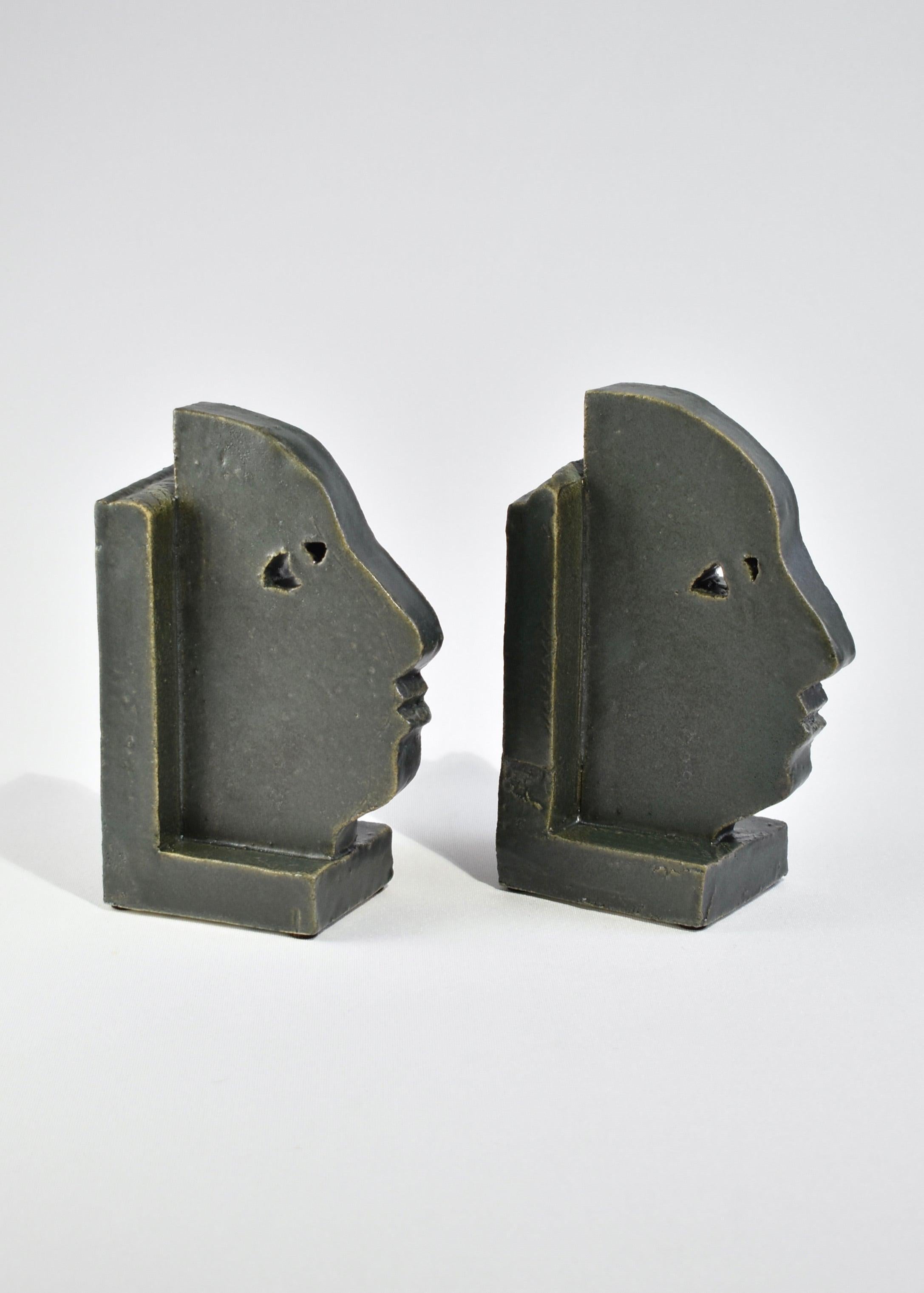 Handmade slab-built bookends with a face profile design in slate grey, set of two. By Shane Gabier, made in NYC.
