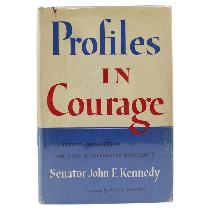 Kennedy Jr., John F. Profiles in Courage. New York: Harper & Brothers, 1956. First Edition. Octavo. Original publisher’s dust jacket and blue linen hardboards with black leather gilt titled spines. 
Presented is a first edition of John F. Kennedy’s
