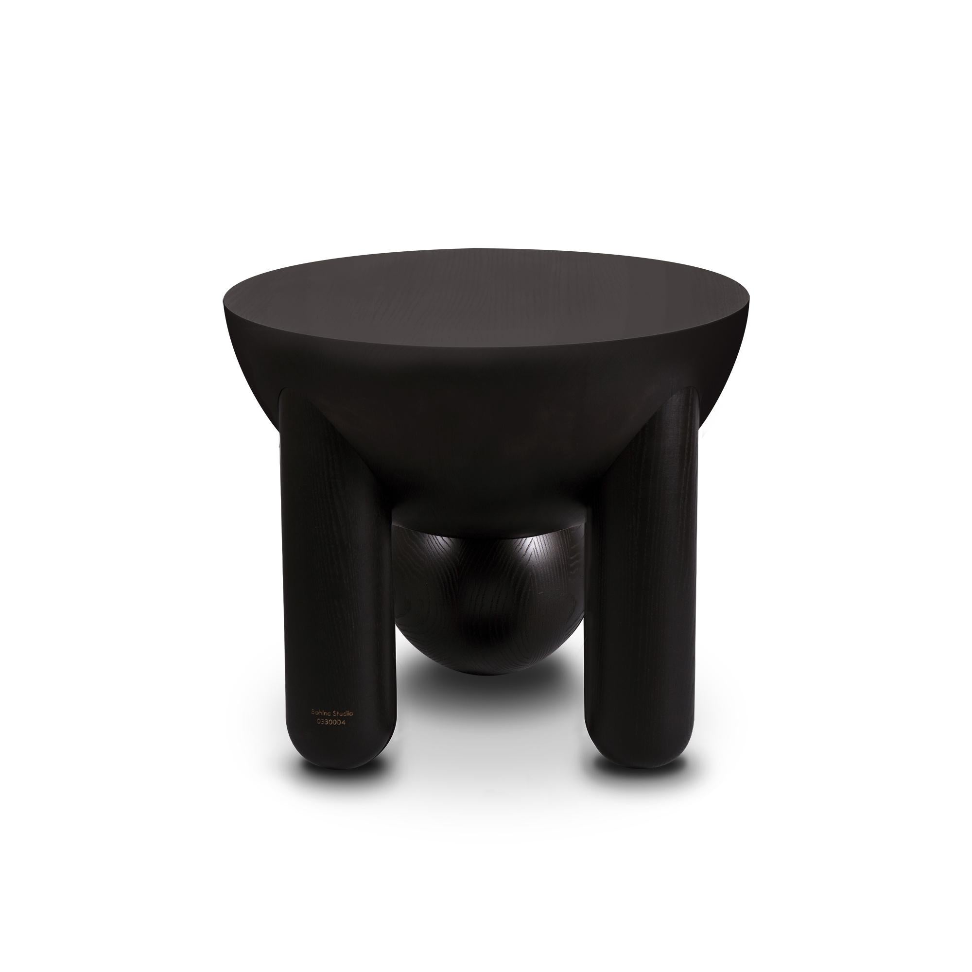 Profiterole small coffee table and Profiterole occasional table are in marble and wood respectively, supported by round dessert-like spheres and semi-cupped legs which support a rounded top. The coffee table comes in nero marquina or white carrara