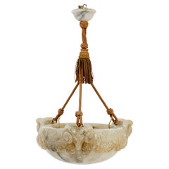 Profusely carved rams head alabaster ceiling light