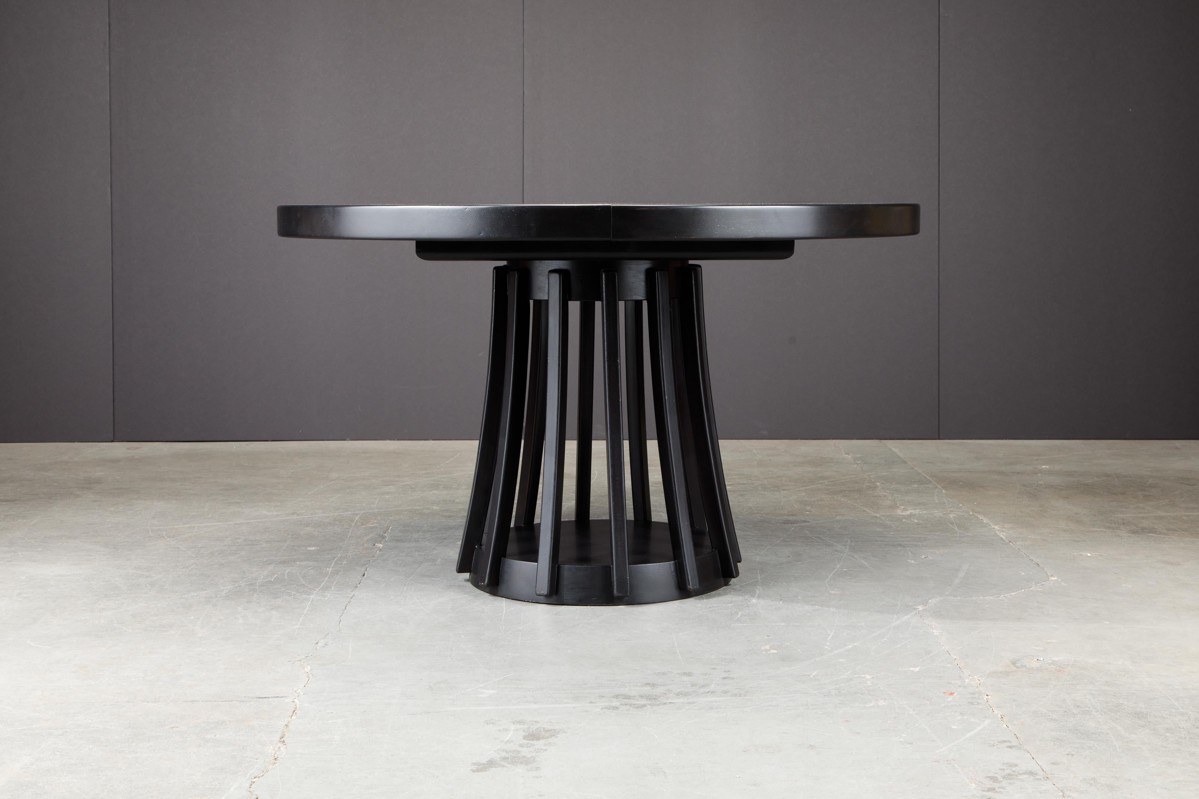 This beautiful extendable ebonized wood dining table was designed by Angelo Mangiarotti in 1972 and manufactured by Sorgente del Mobili, Italy as part of the 'Programma S11' series. This dining table features twelve slatted lefts connected to a