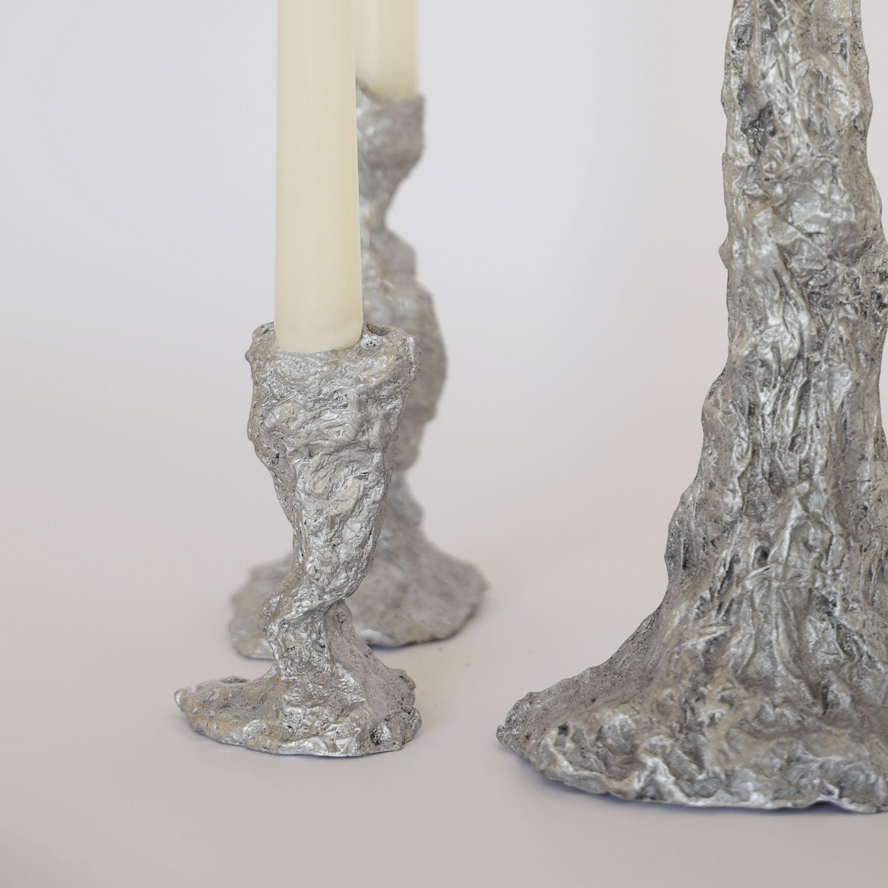 We sculpt each candlestick with aluminum foil before sand-casting it in aluminum at our local foundry. It’s a physical ‘game of telephone’, a translation, or a conversation, or maybe a pun. 

A humble-but-striking, utilitarian-but-elegant, perfectly