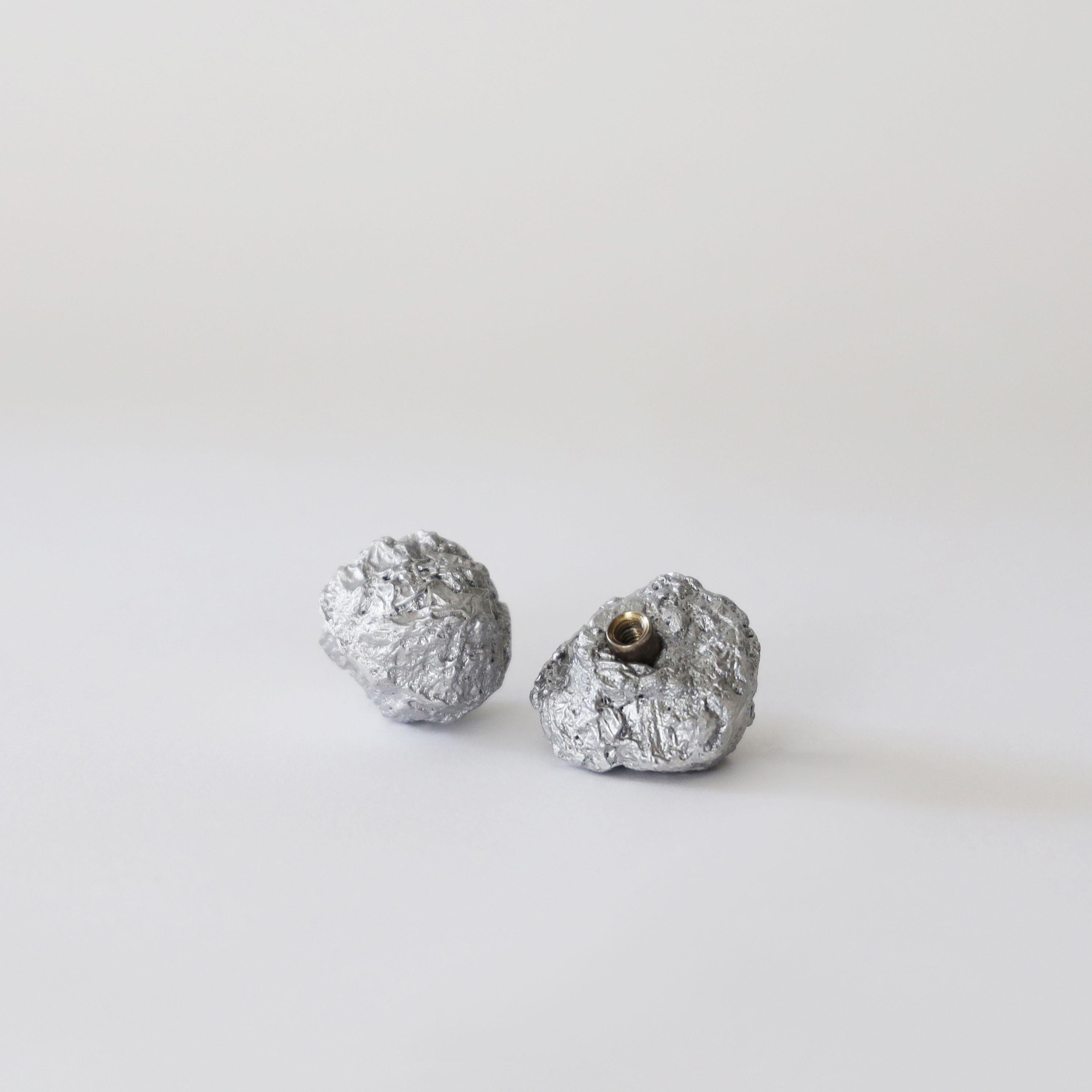 We sculpt each knob with aluminum foil before sand-casting it in aluminum at our local foundry. It’s a physical ‘game of telephone’, a translation, or a conversation, or maybe a pun.

A humble-but-striking, utilitarian-but-elegant, perfectly