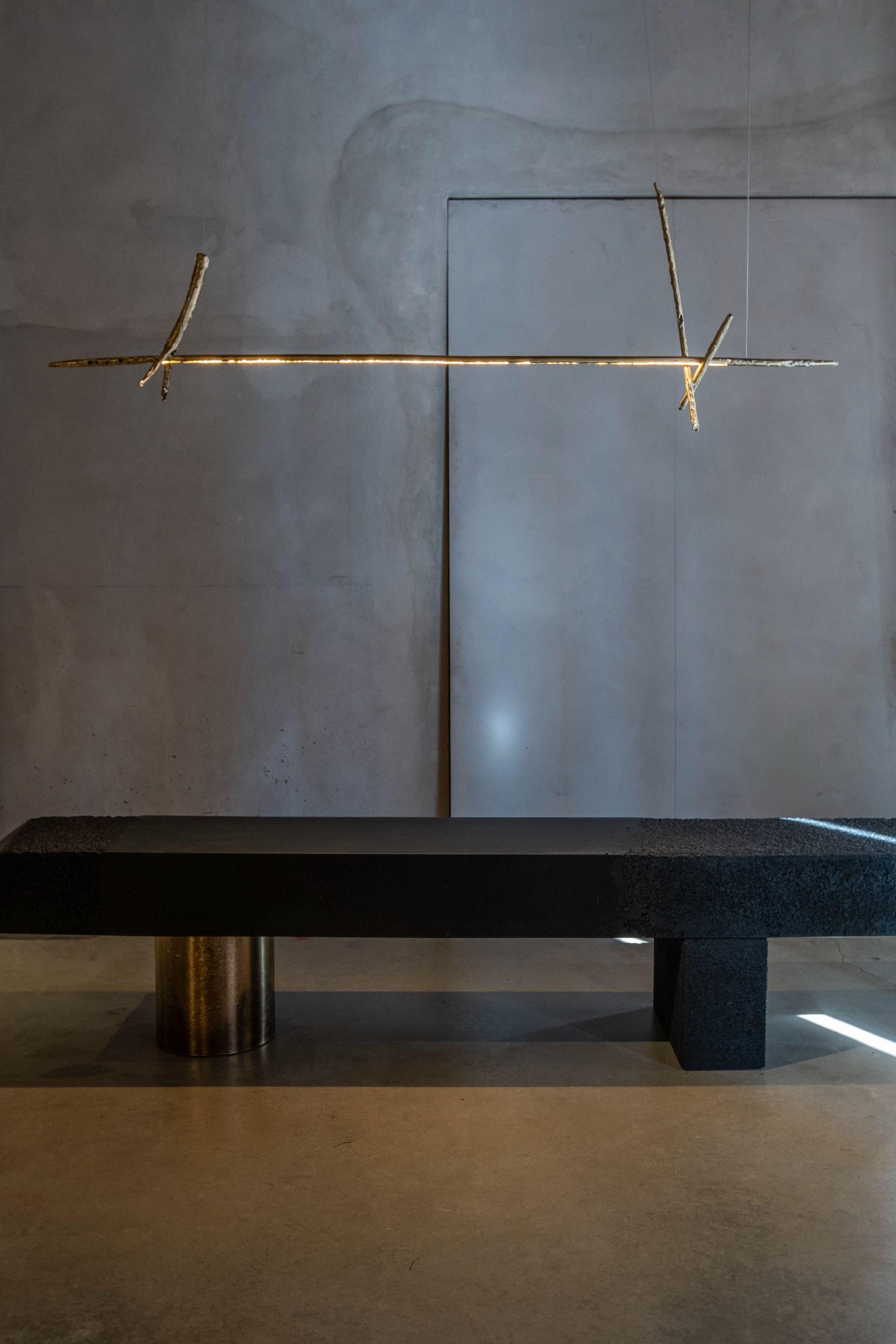 Prometeo chandelier by Morghen Studio
Materials: Brass, LED light, silicone
Dimensions: 165 x 20 x 50 cm
Light source: LED 24v - 20 w - 2.500 lm - 2.700/3.000 k - dimmable

Prometeo is a Collection of objects arisen from the research on a
