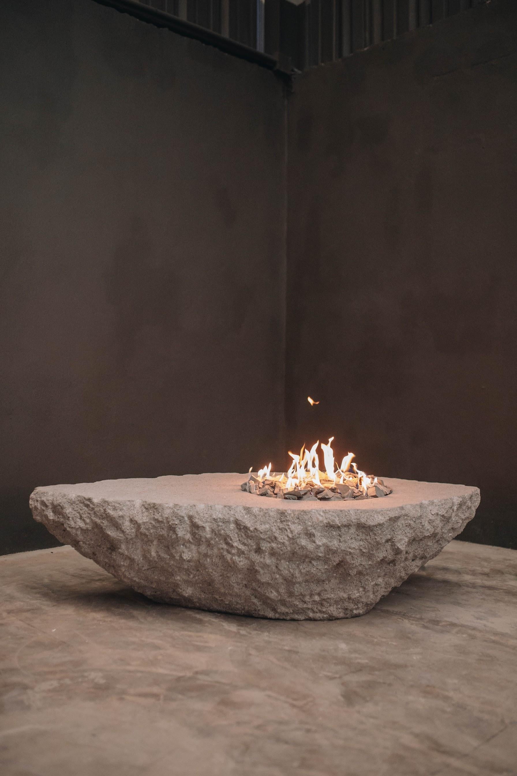 Prometeo fire table by Andres Monnier Treko Concrete
Dimensions: 150 x 90 x H 45 cm
Materials: Stainless steel. Quarry stone.
Technique: Hand-crafted. A mix of polished and unfinished looks. 
Weight: 340 kg

Prometeo fire table is a piece inspired
