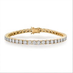 Bracelet tennis en or jaune 14K (ou 18k sur demande) serti de diamants ronds.