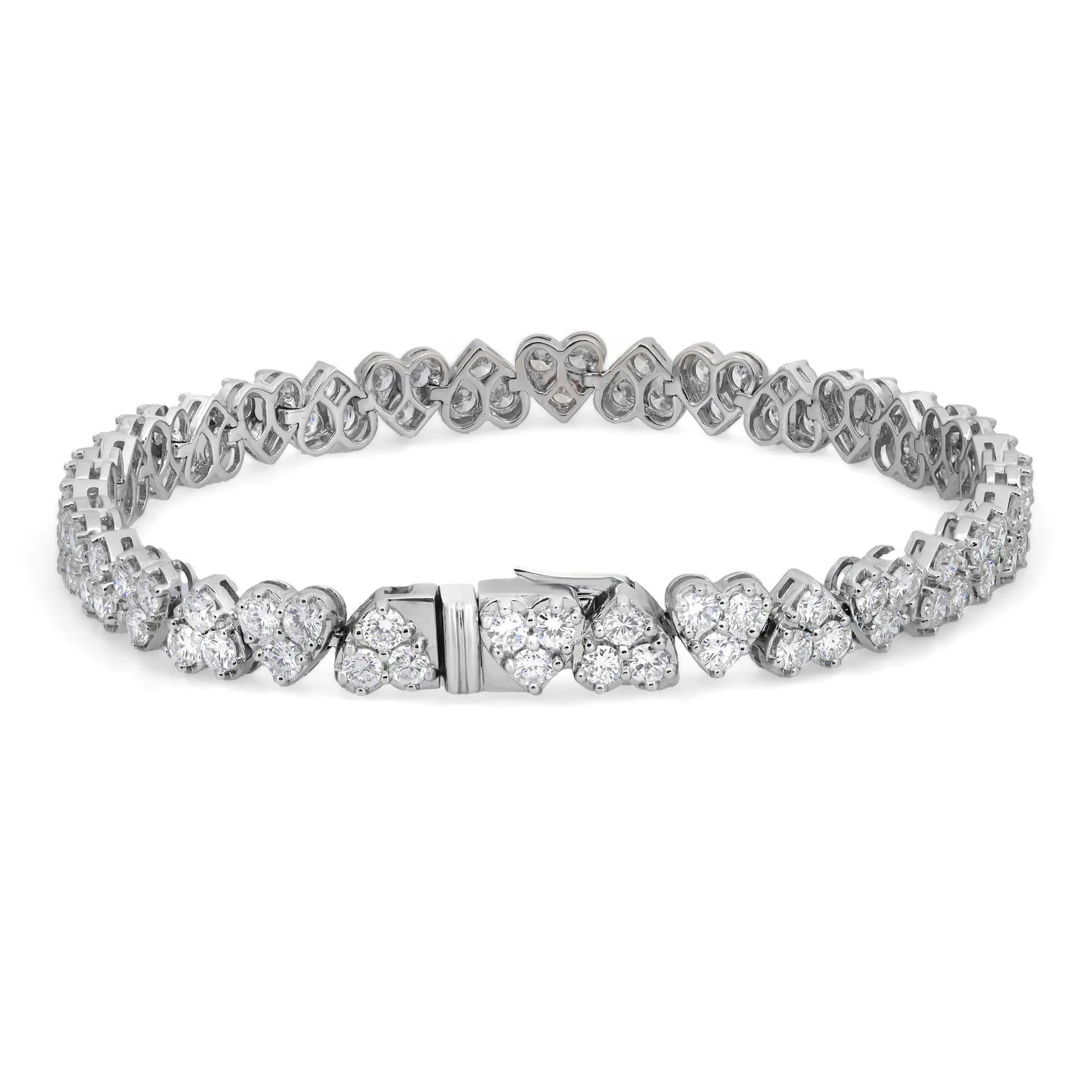 This exquisite Rachael Koen tennis bracelet features sparkling prong set round brilliant cut diamonds studded in heart shaped links. Crafted in high polished 18k white gold. Lightweight, super stackable, and a perfect gift for your loved ones. This