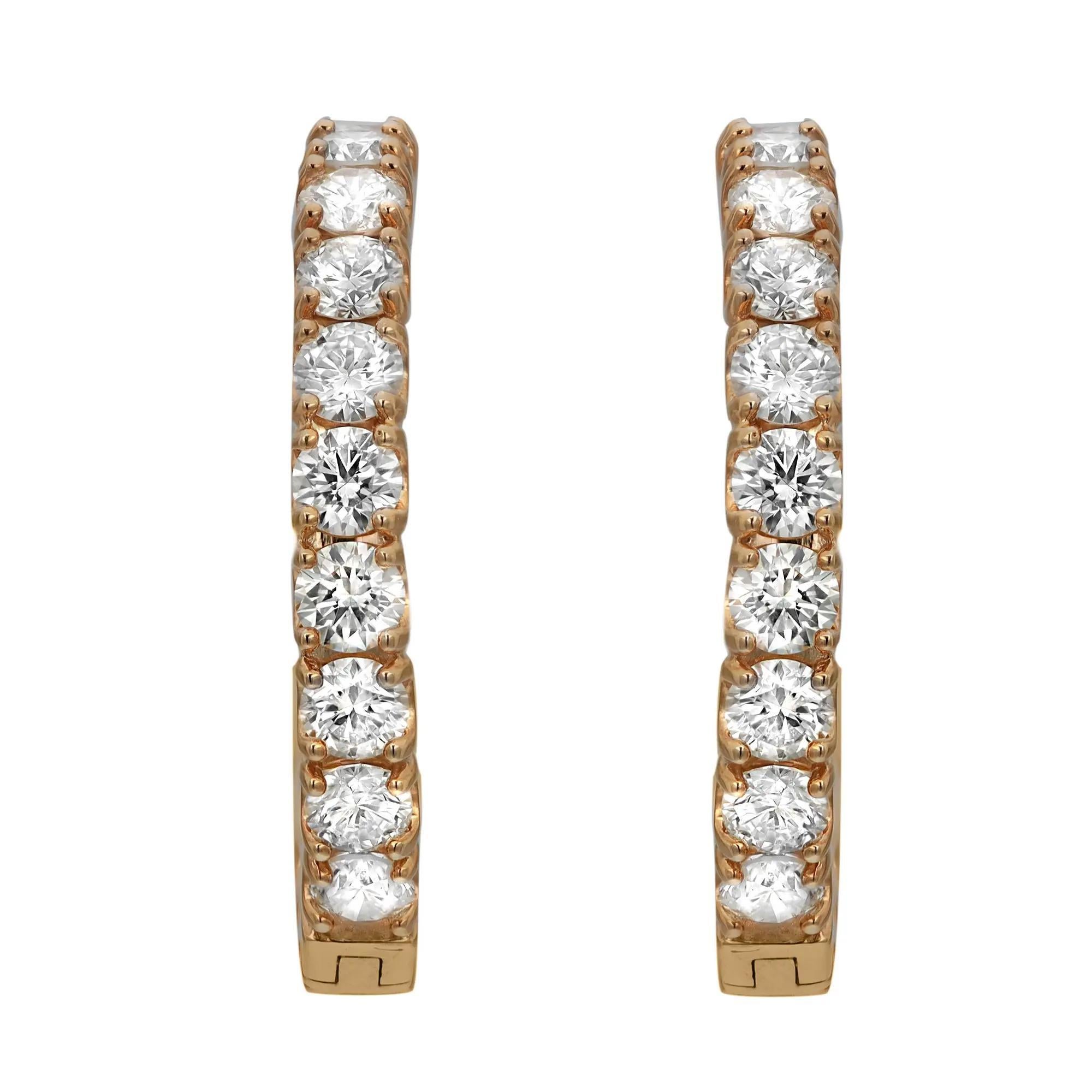 Sparkle all way with these beautiful inside out diamond hoop earrings. Crafted in fine 14K yellow gold. These earrings feature single line prong set dazzling round brilliant cut diamonds weighing 3.19 carats. The diamonds line half of the outer hoop