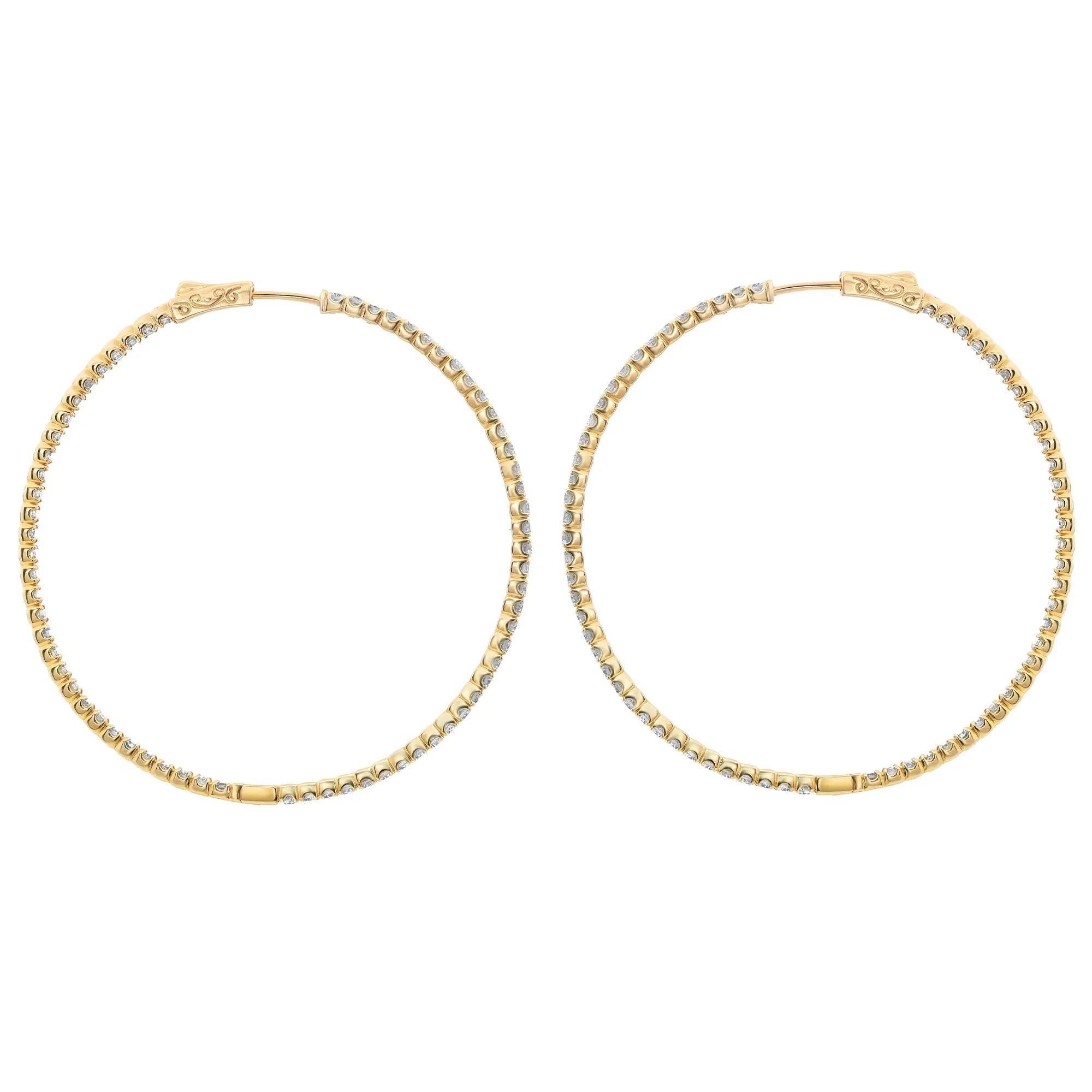 Add a touch of sparkle to your look with these beautiful large inside-out diamond hoop earrings. Expertly crafted in high-quality 14K yellow gold, these earrings feature prong-set round brilliant cut diamonds, half on the outer hoop and half on the