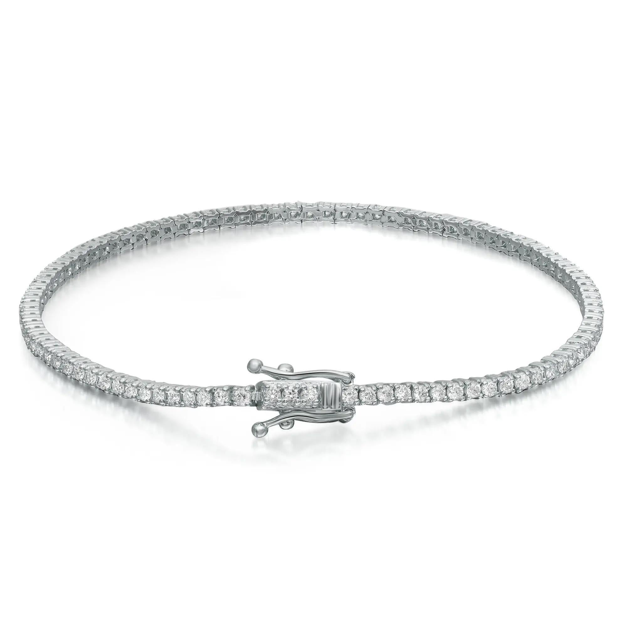 This beautifully crafted Rachel Koen tennis bracelet features prong set round brilliant cut diamonds studded in lustrous 14K white gold. Total diamond weight: 0.95 carat. Diamond Quality: G-H color and VS-SI clarity. Bracelet length: 7 inches.