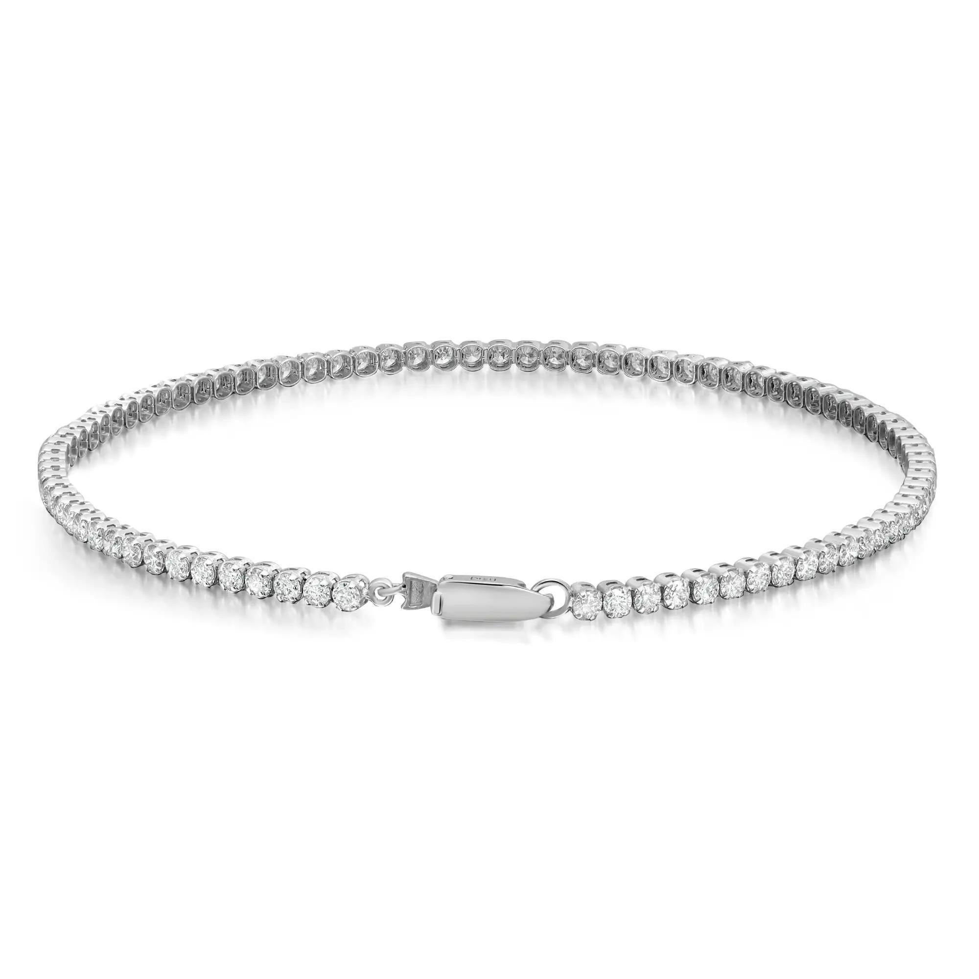 Add a touch of sparkle to your wrist with this beautiful and shimmering prong set round brilliant cut diamond tennis bracelet. Crafted in 14K white gold. Super stackable and easy to wear. Total diamond weight: 2.02 carats. Diamond color G-H and